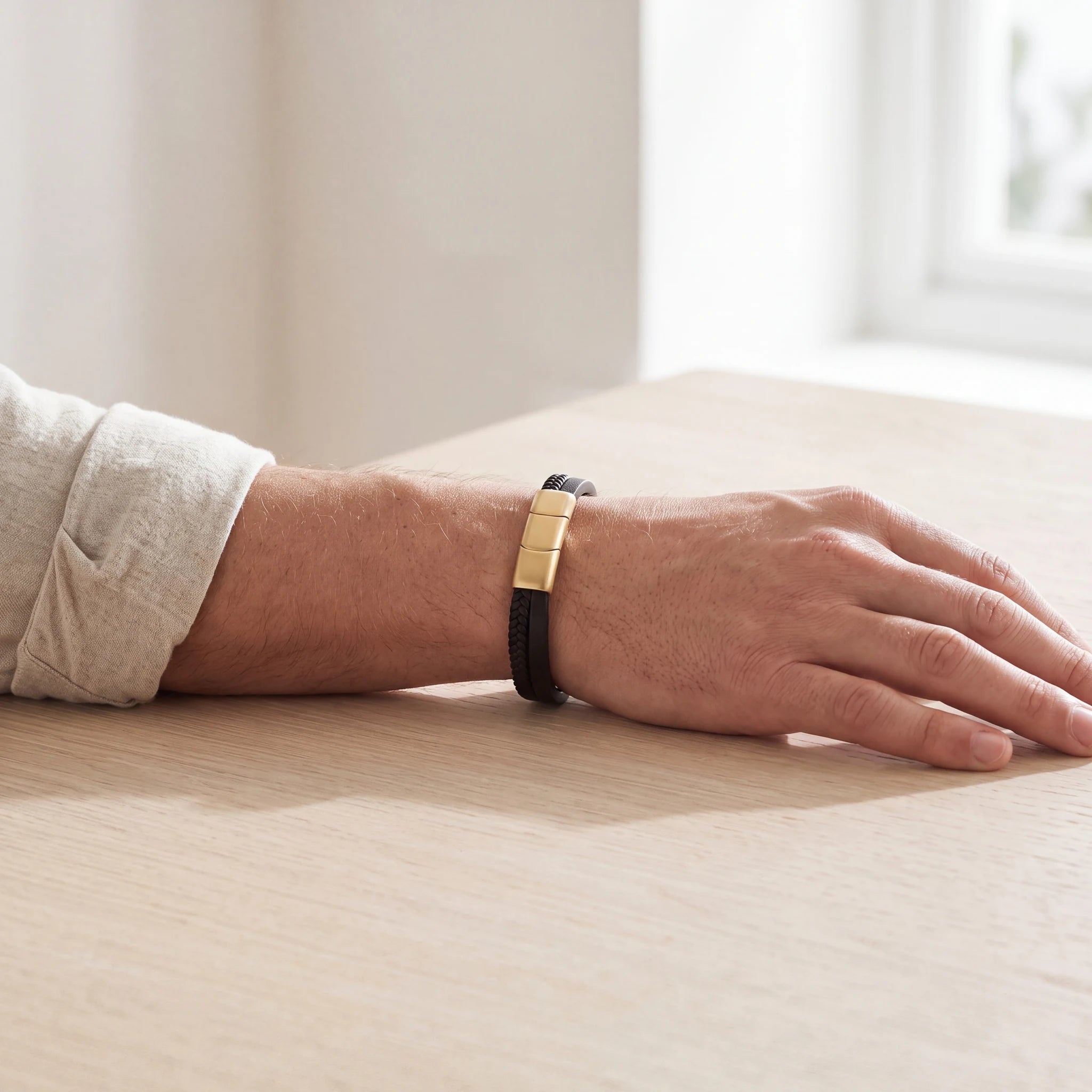 Adjustable-Braided-Leather-Ashes-Bracelet-For-Men-in-Black-and-Gold-Worn