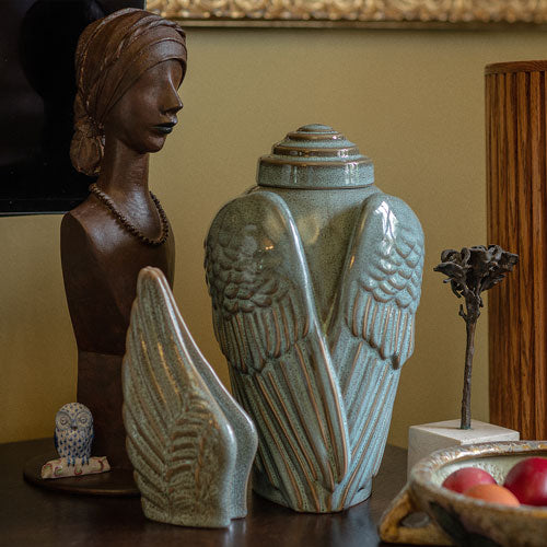 Angel Wings Ashes Keepsake Urn Range Oily Green on Table