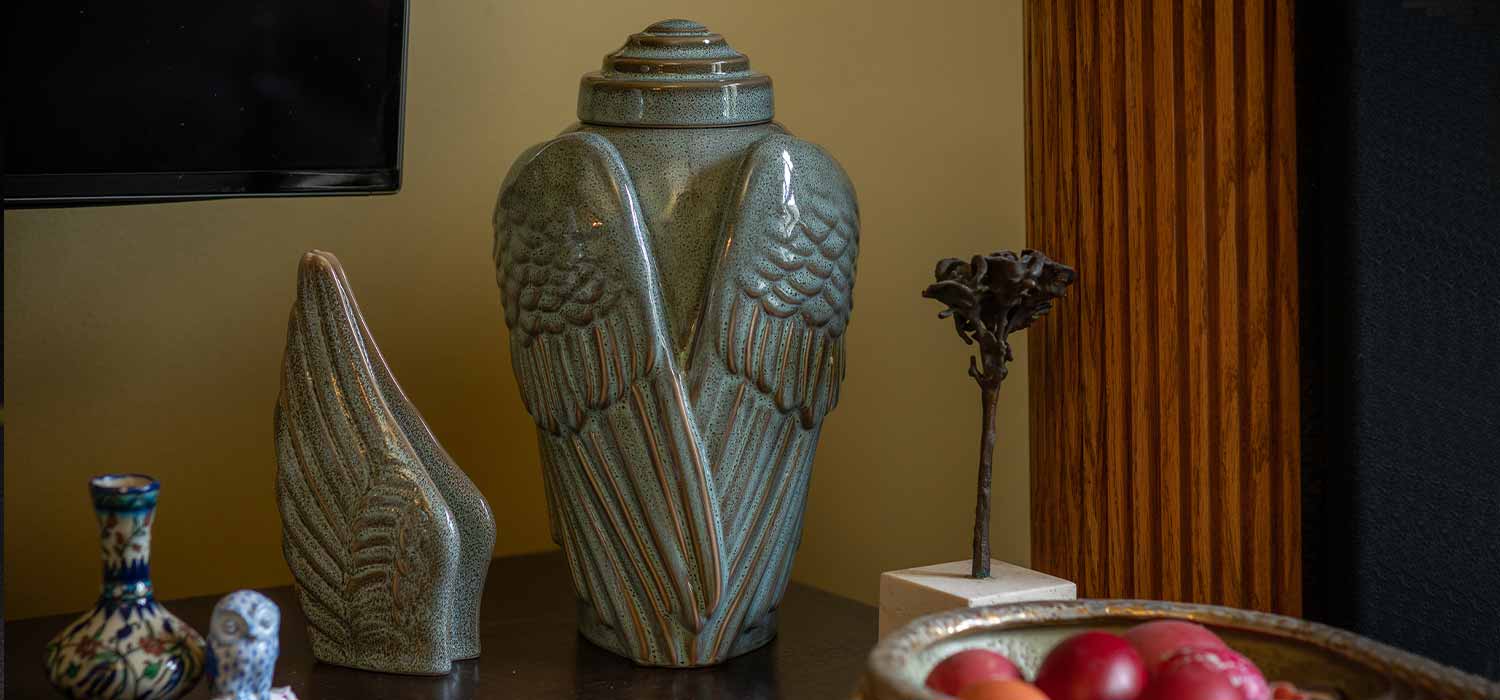 Angel Wings Ashes Keepsake Urn on Table Top Oily Green