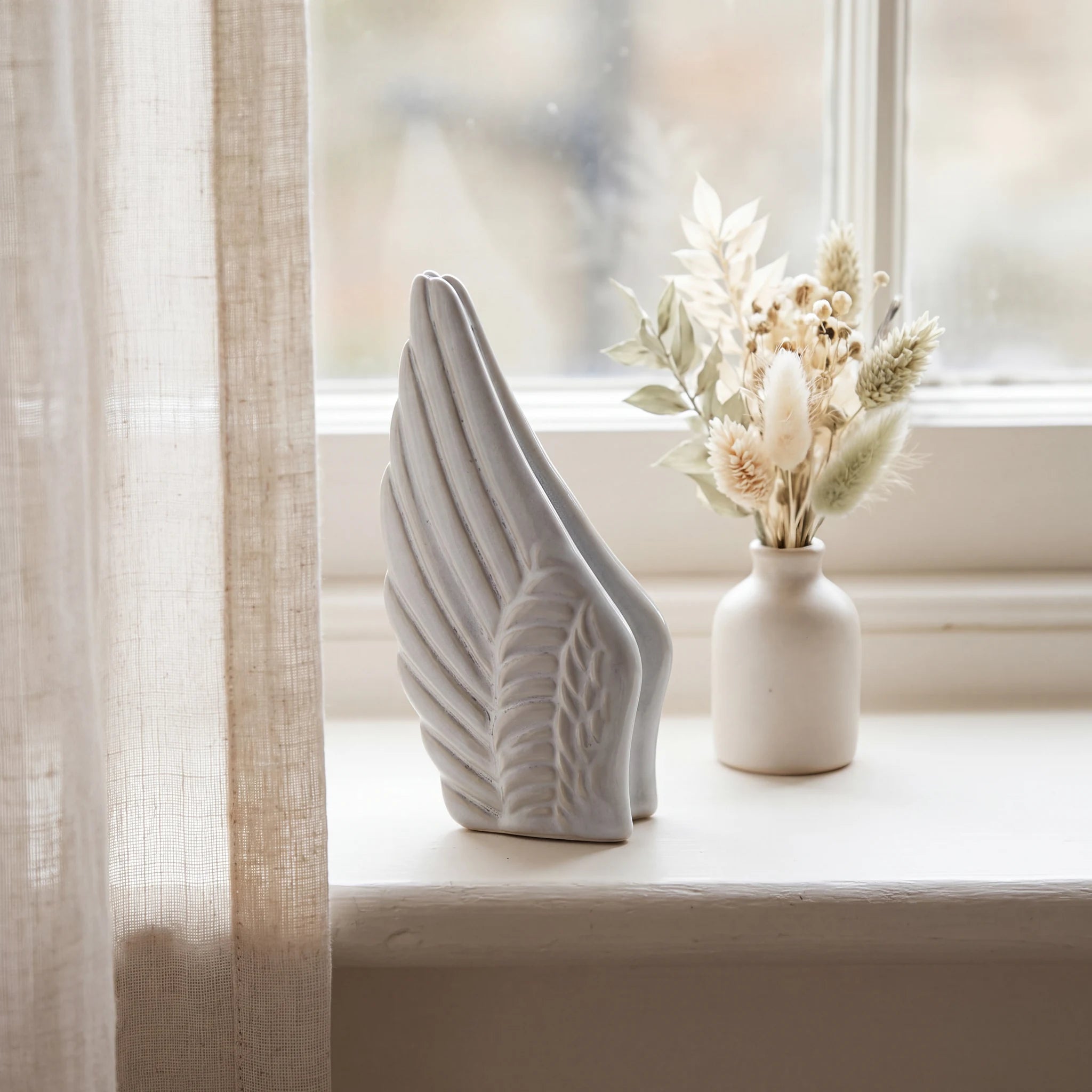 Angel-Wings-Small-Urn-for-Ashes-in-Grey-keepsake_windowsill_posy