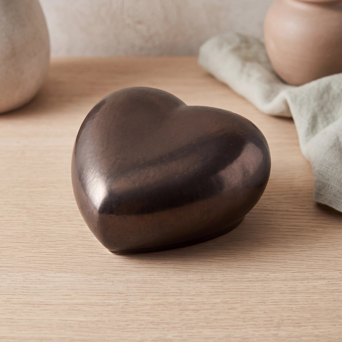 Big-Heart-Classic-Urn-for-Ashes-in-Antic-Gold-On-Oak