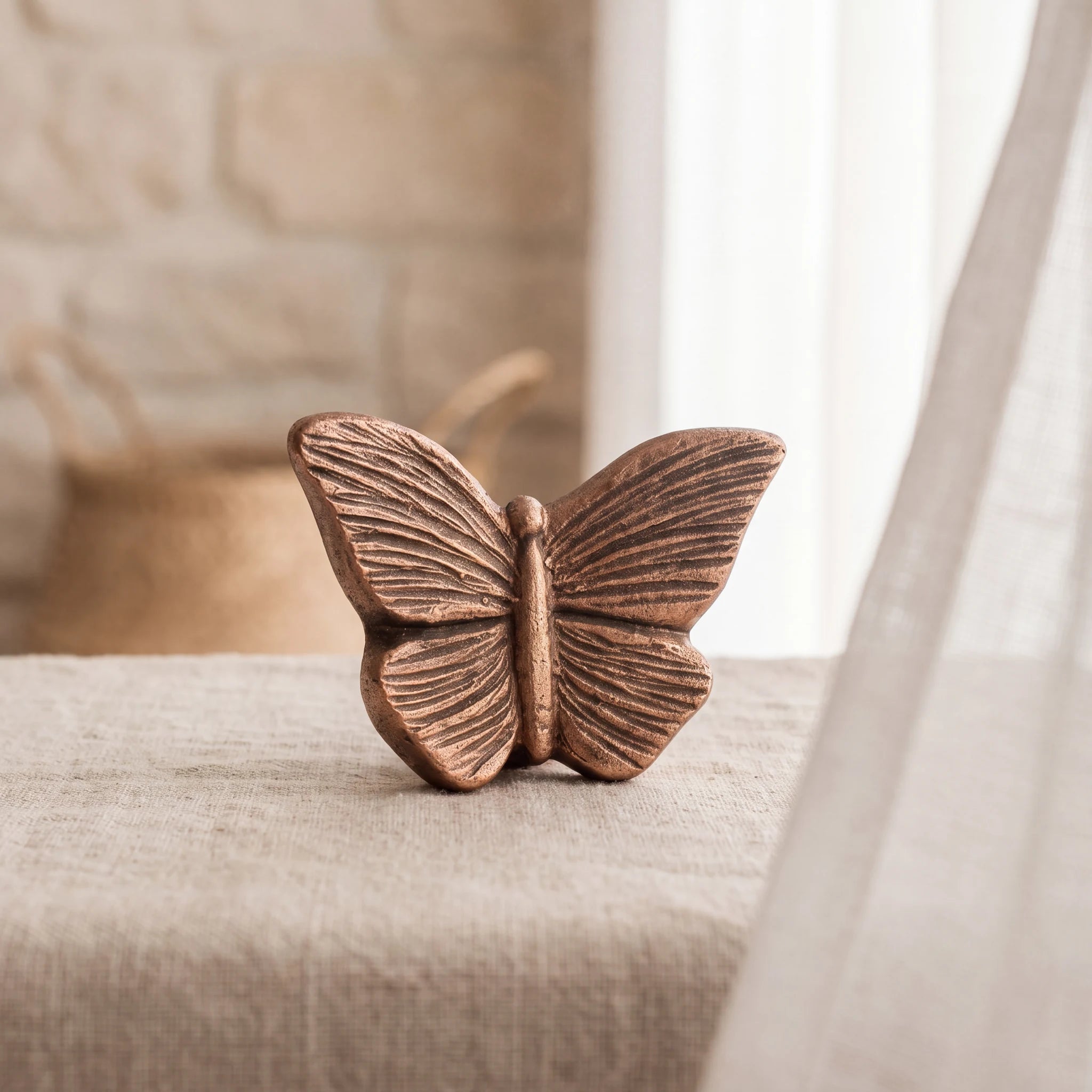 Butterfly-Keepsake-Urn-for-Ashes-in-Bronze-Linen-Table