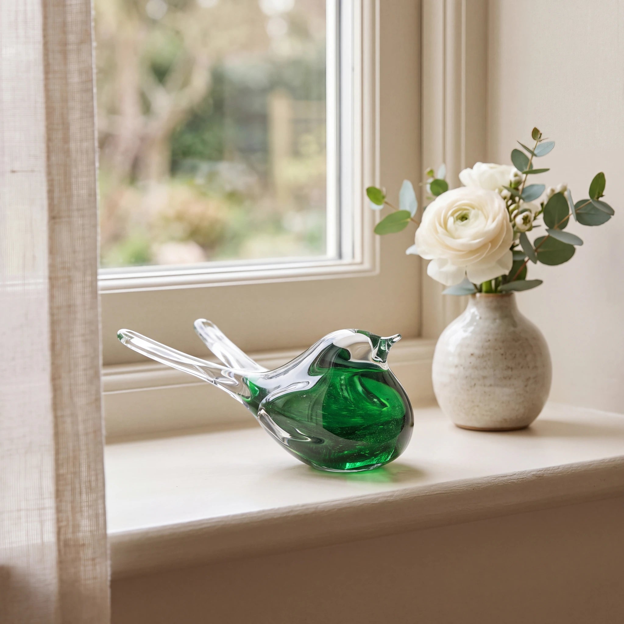 Crystal-Songbird-Keepsake-Urn-for-Ashes-in-Green-keepsake_windowsill_posy