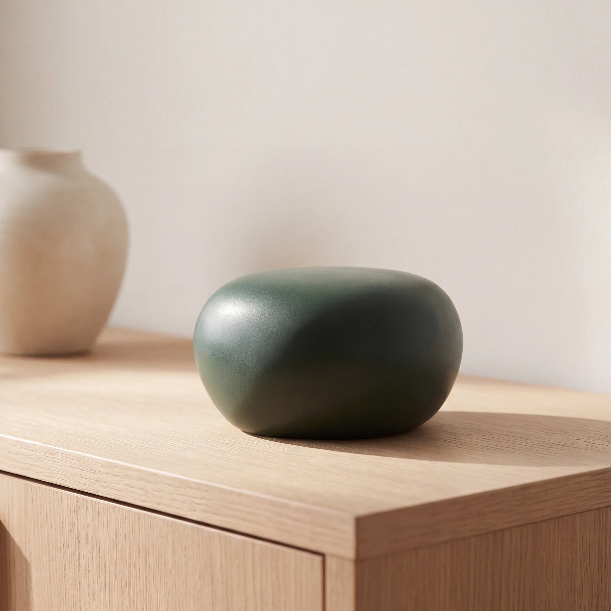 Cuddle-Stone-Keepsake-Urn-for-Ashes-in-Forest-Green-Oak-Console
