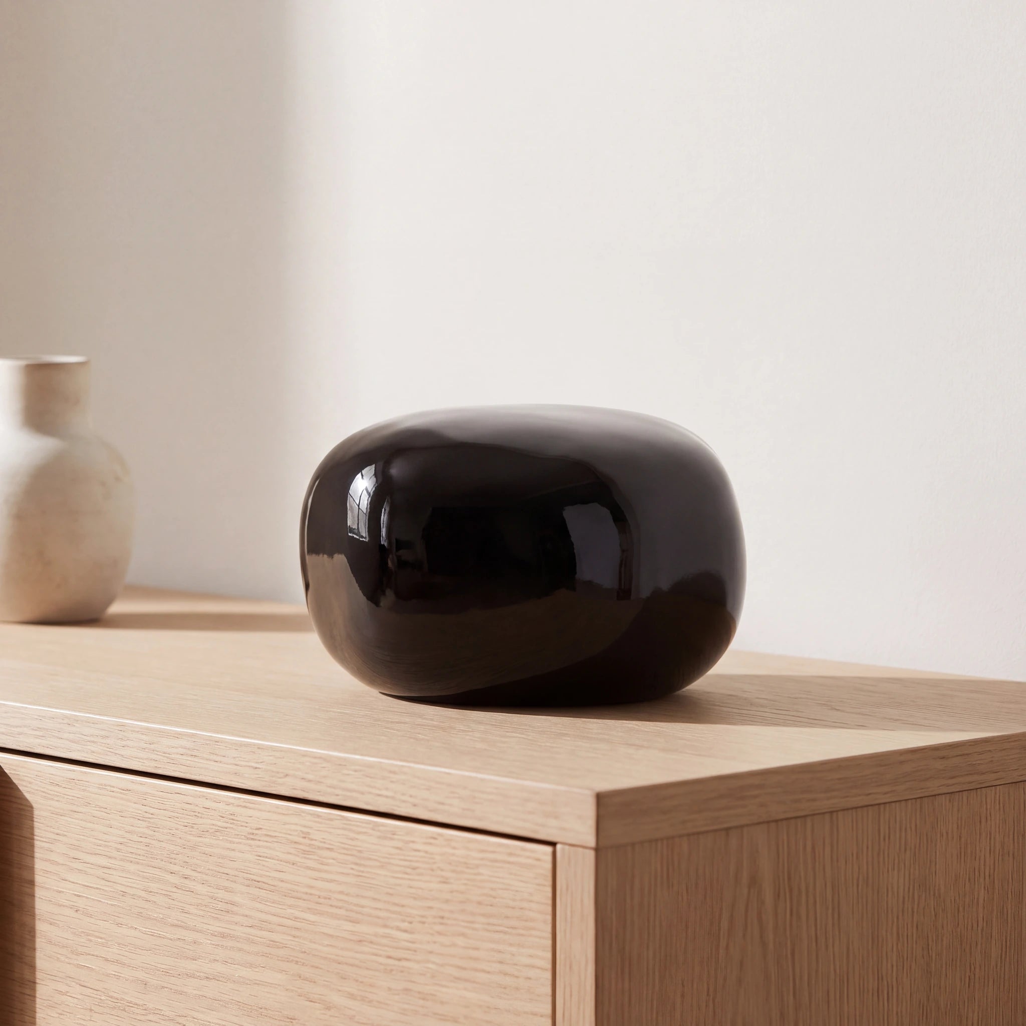 Cuddle-Stone-Keepsake-Urn-for-Ashes-in-Glossy-Black-Oak-Console