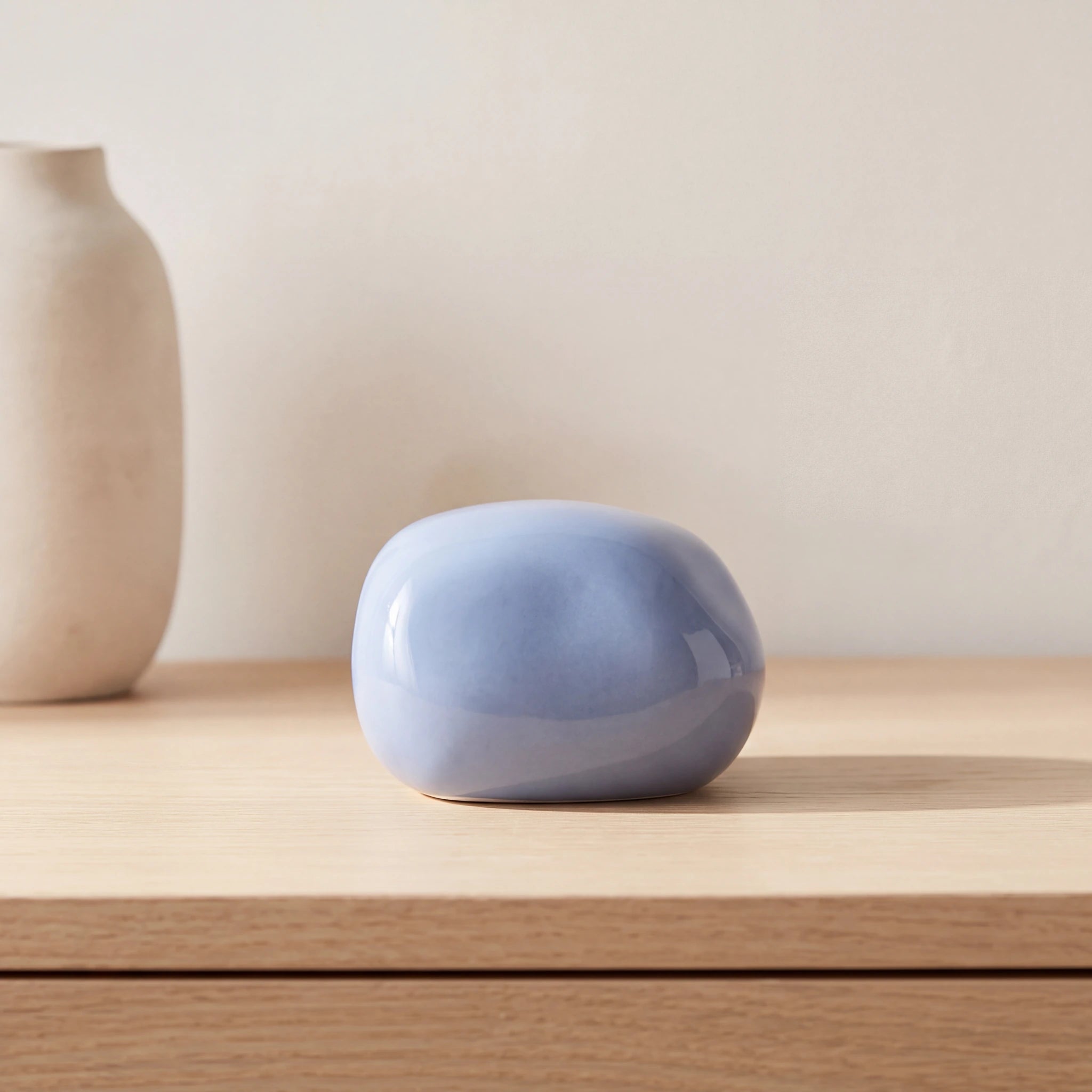 Cuddle-Stone-Keepsake-Urn-for-Ashes-in-Light-Blue-Oak-Console