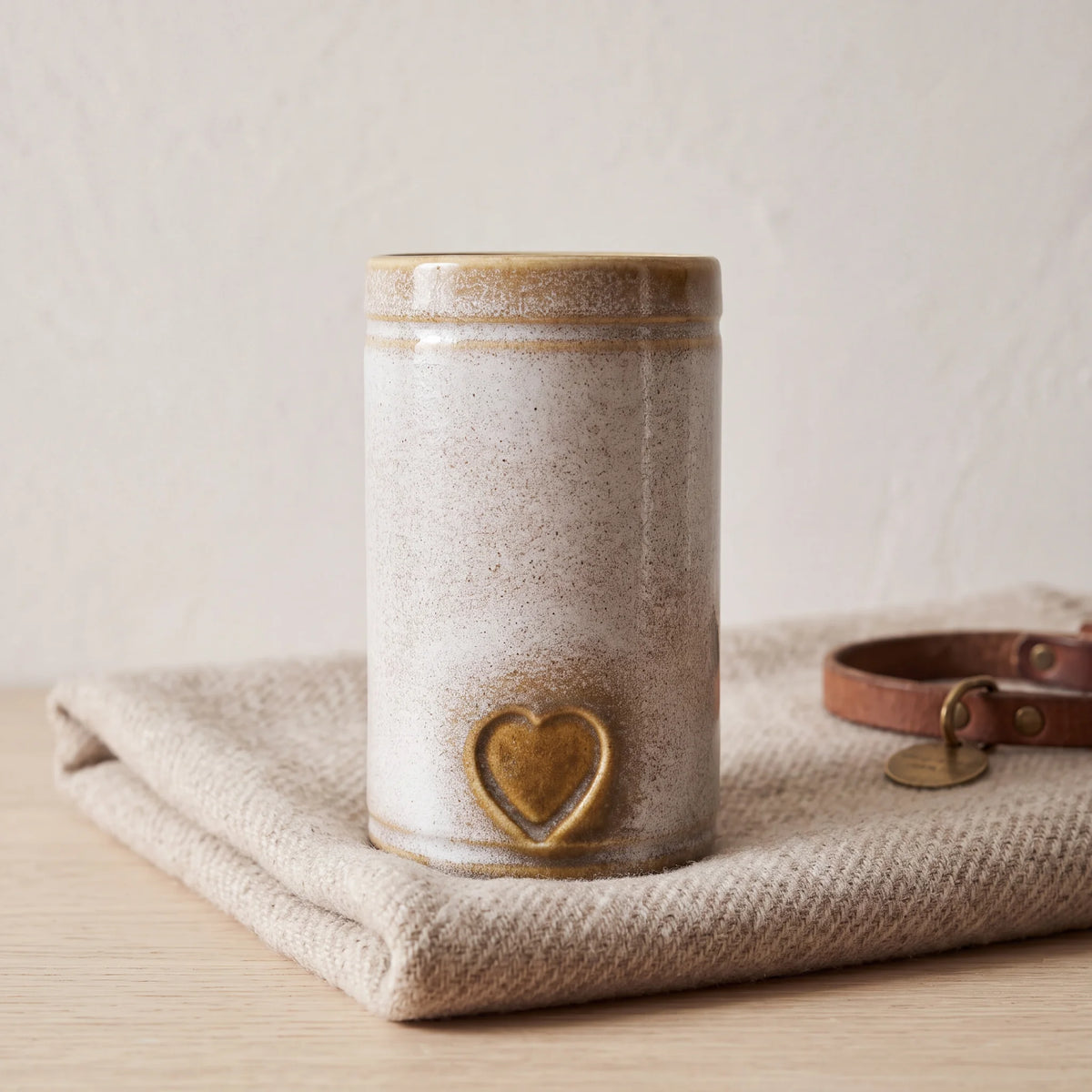 Cylinder-Pet-Urn-for-Ashes-in-Sandy-White-pet_blanket_fold