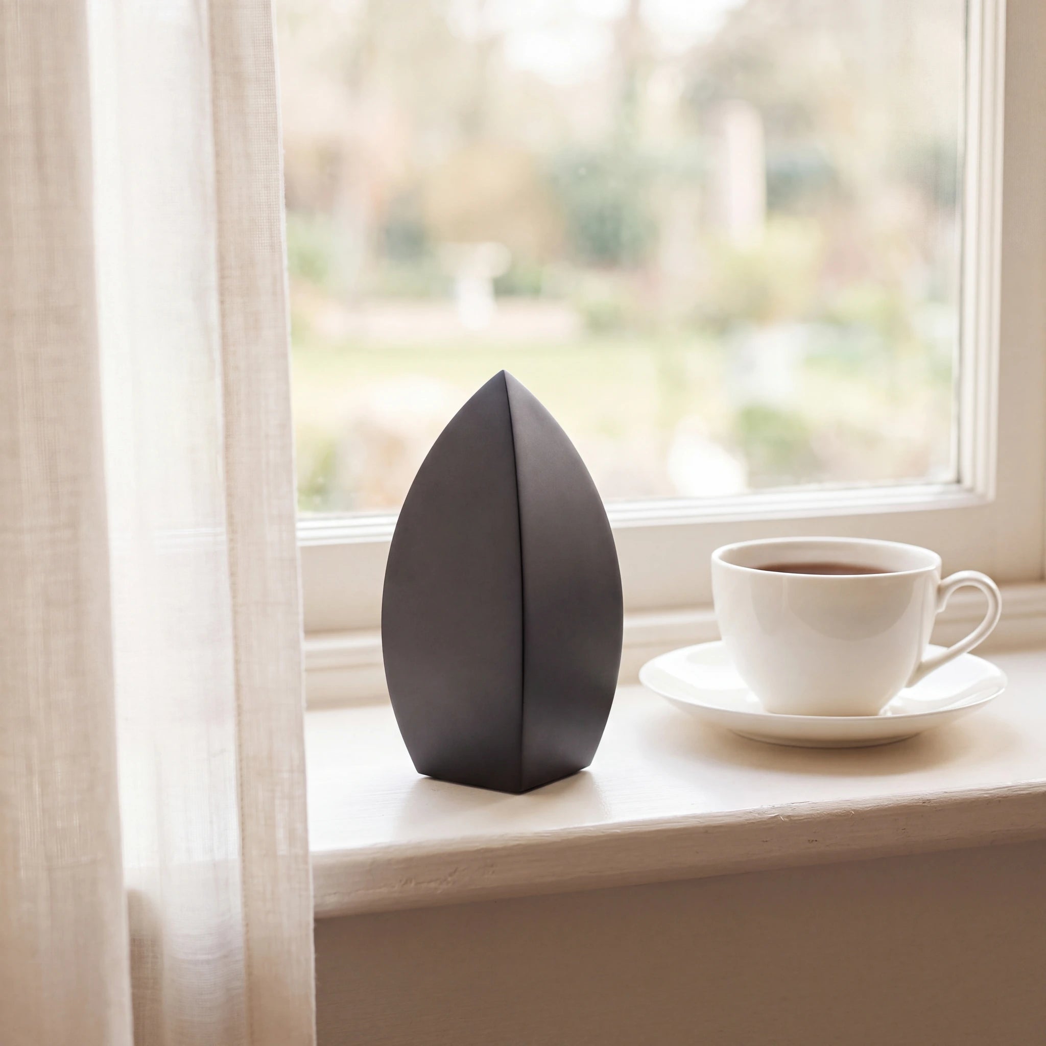 Drop-Small-Urn-for-Ashes-in-Matte-Black-Stainless-Steel-keepsake_teacup_sill