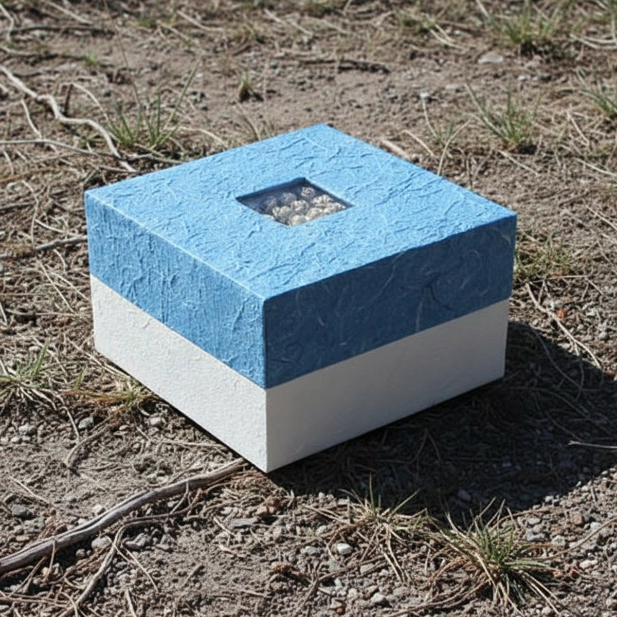 Embrace Biodegradable Urn for Ashes in Blue Medium Outside Side View in Sunlight
