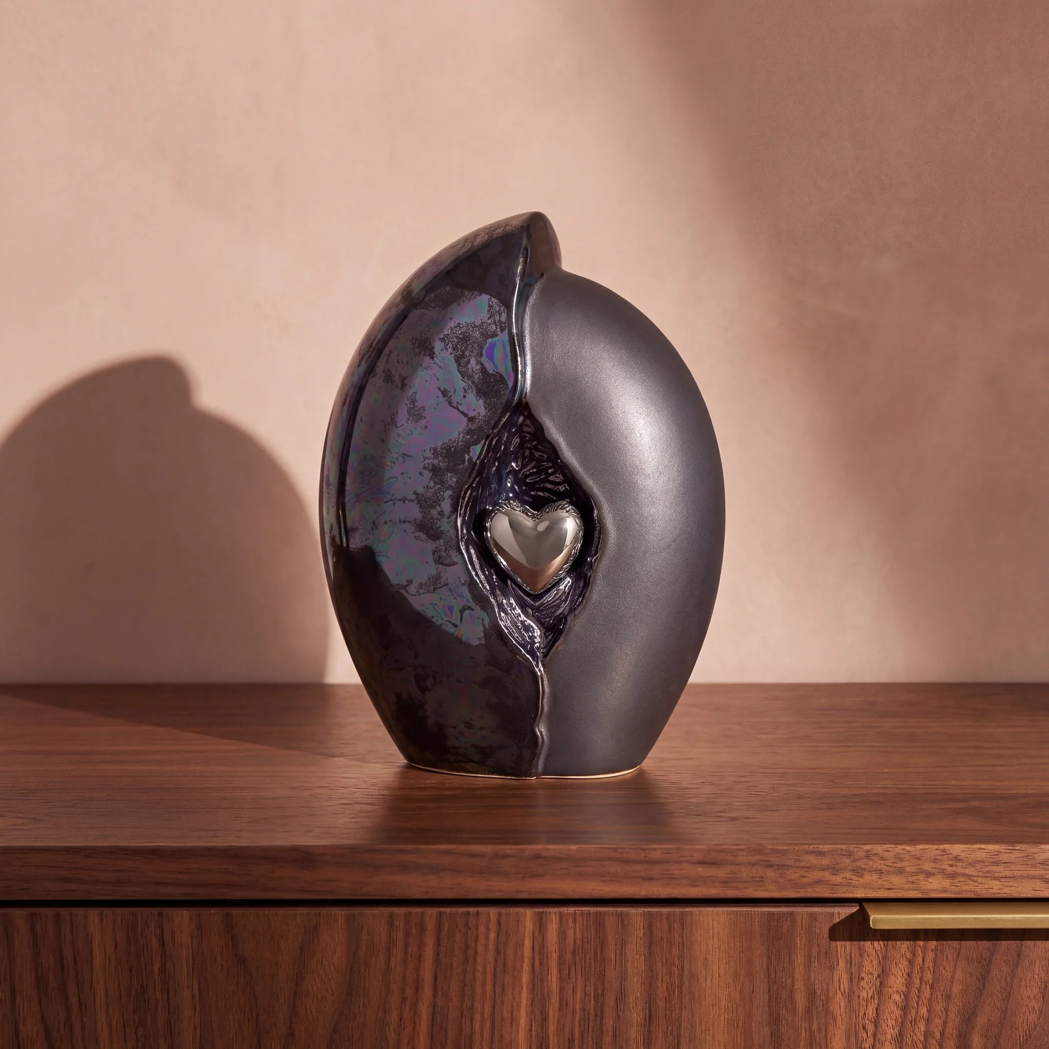 Embrace-Heart-Medium-Urn-for-Ashes-in-Dark-Blue-and-Black-Walnut-Sideboard