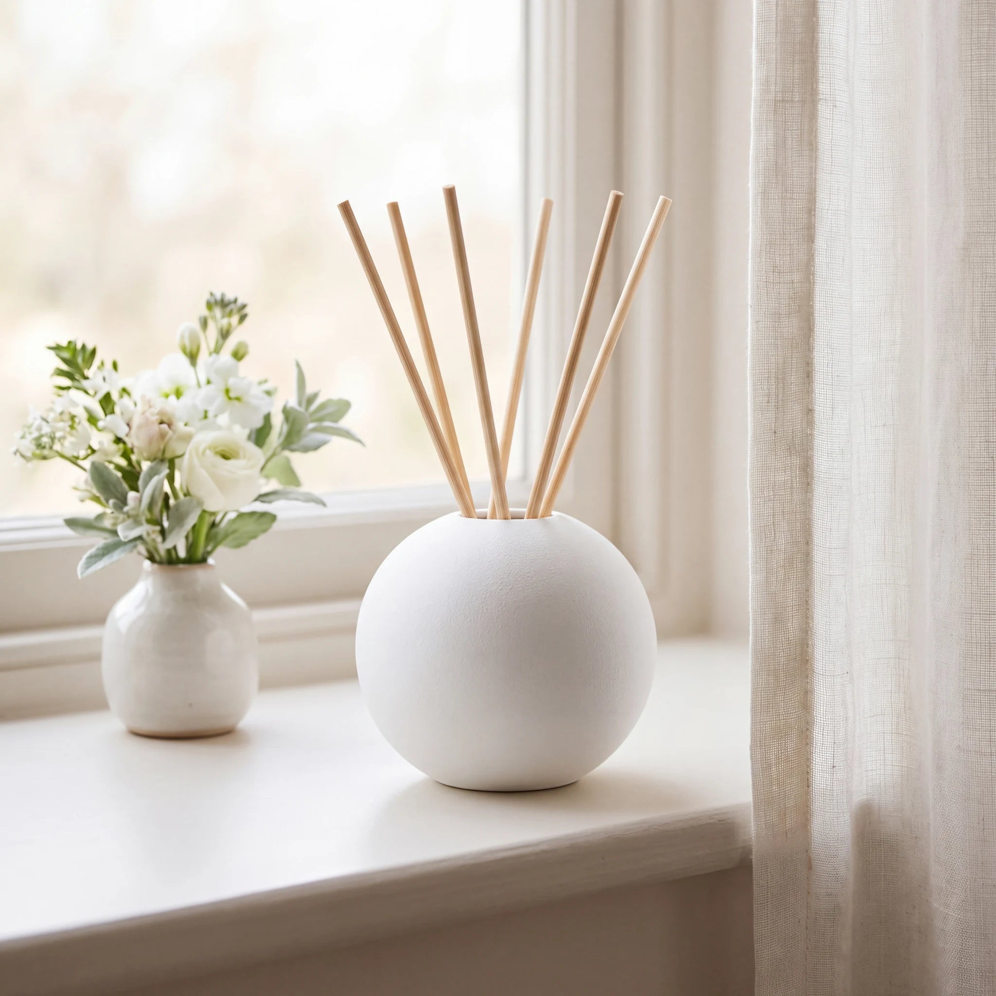 Essence-of-Life-Scented-Keepsake-Urn-for-Ashes-in-White-keepsake_windowsill_posy