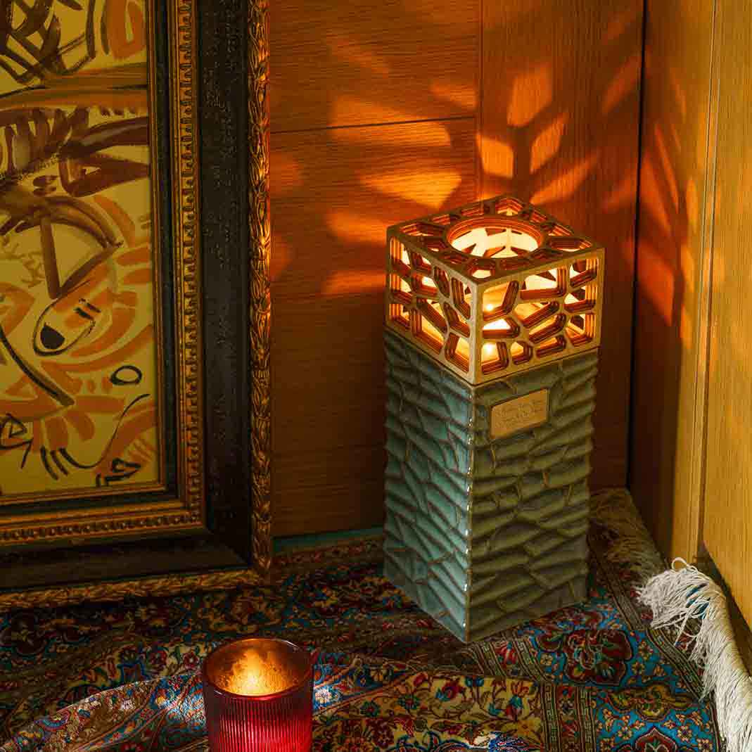 Eternal Lantern Candle Adult Cremation Urn for Ashes Oily Green Right Above Angle In Home