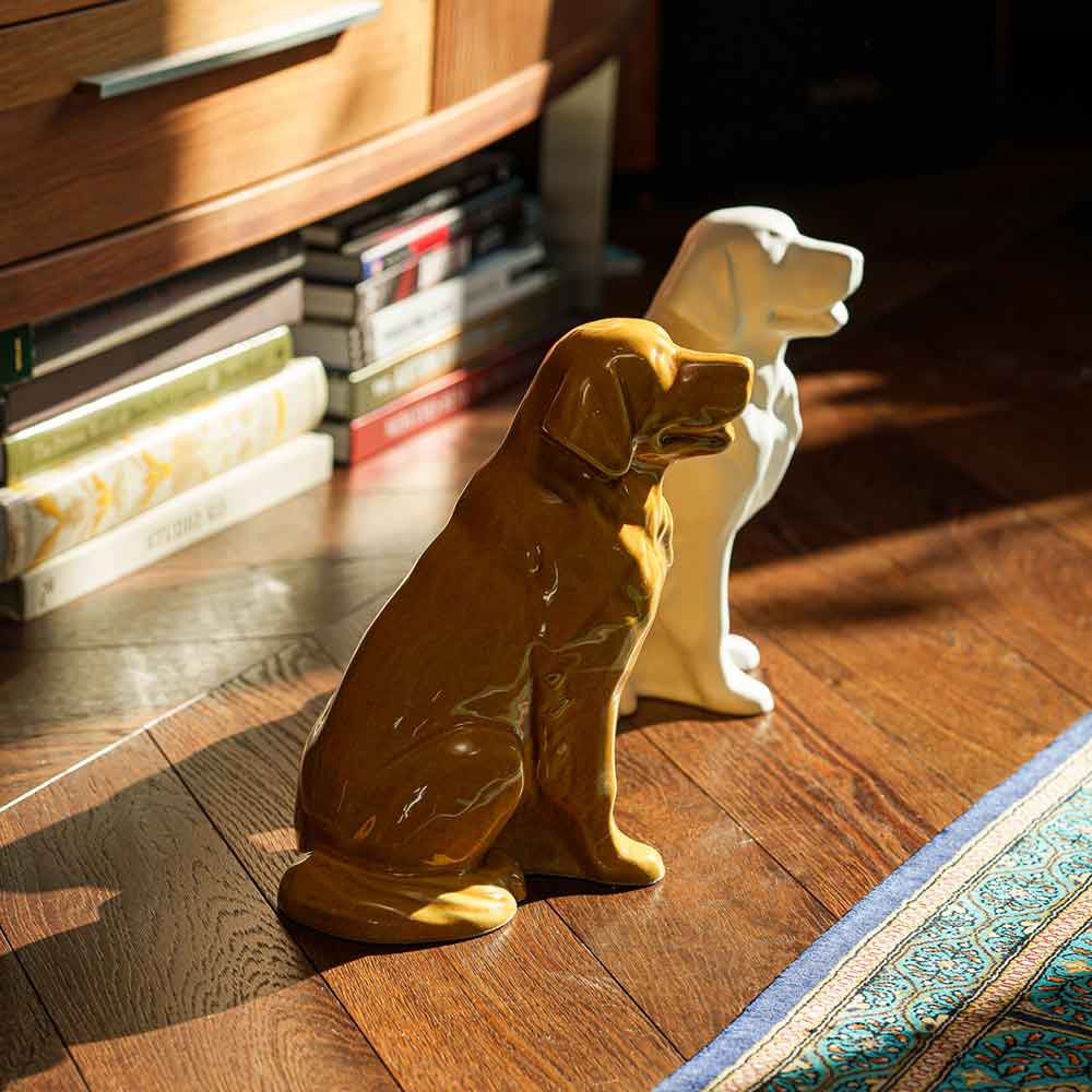 Golden Retriever Pet Urn for Ashes in Gold And Matte White on Floor Copy