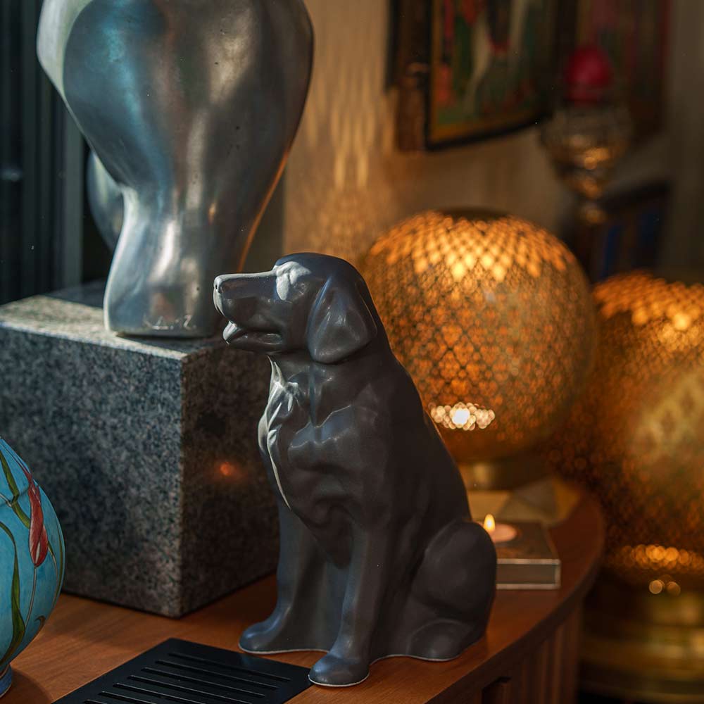 Golden Retriever Pet Urn for Ashes in Matte Grey on Shelf Left