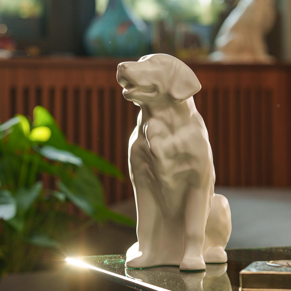 Golden Retriever Pet Urn for Ashes in Matte White on Table Looking Up Light