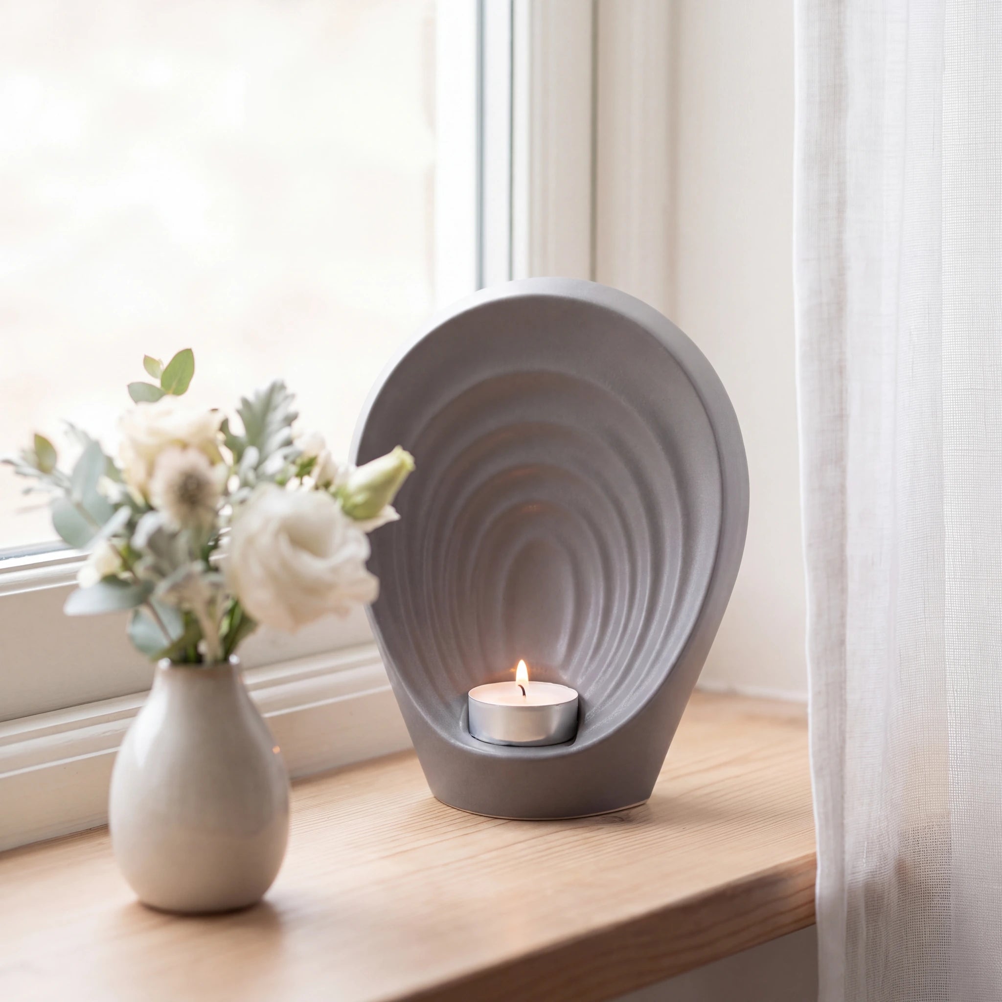 Guardian-Angel-Small-Urn-for-Ashes-in-Matte-Grey-keepsake_windowsill_posy-Left-Angle