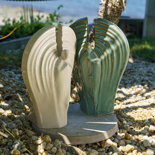 Guardian Cremation Urn for Ashes Oily Green and Cream Outside in the Sun