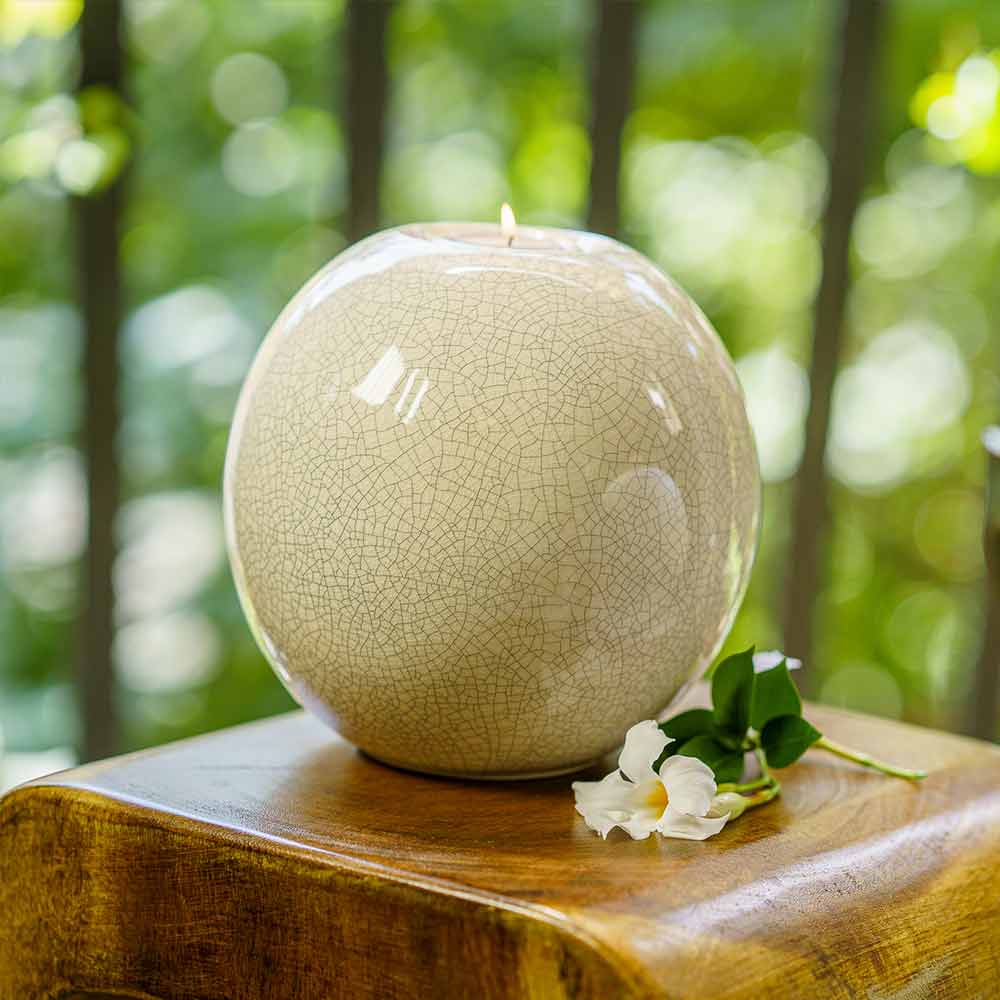 Harmony Adult Cremation Urn for Ashes in Crackle Glaze Outside on Table