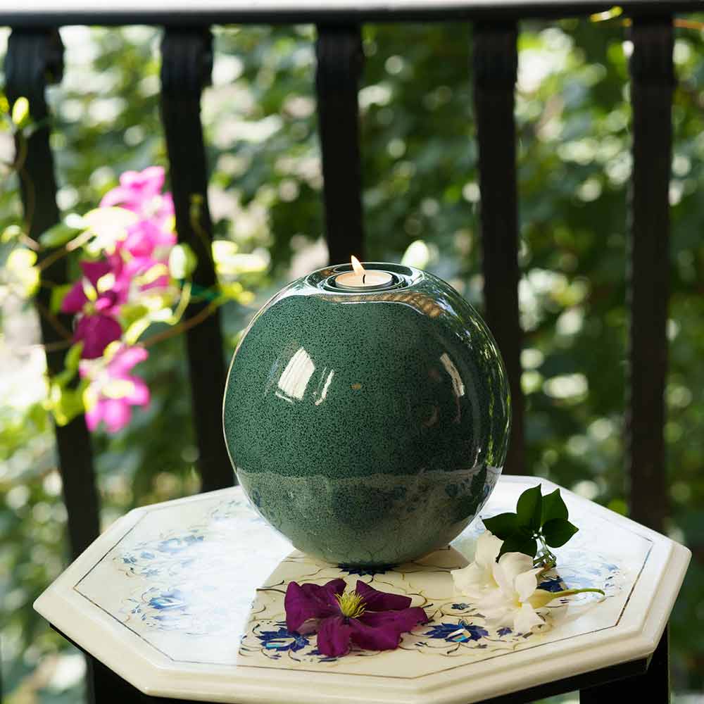 Harmony Adult Cremation Urn for Ashes in Oily Blue Melange Front View Outside on Table