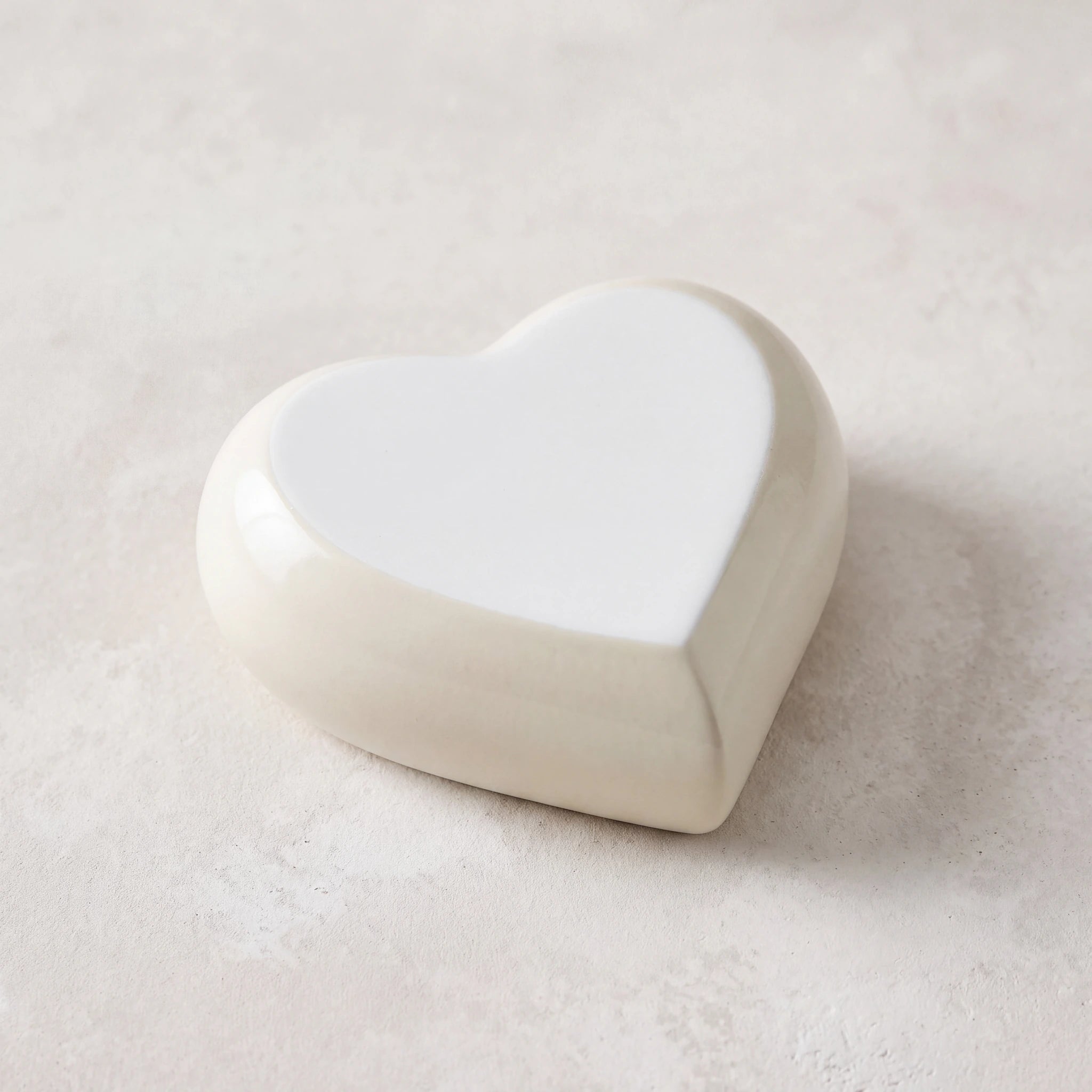 Heart-Keepsake-Urn-for-Ashes-in-Ivory-White-Metal-heart_plaster_above