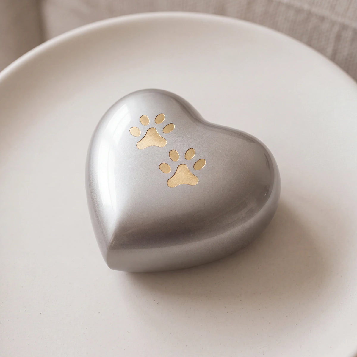 Heart-Pawprints-Pet-Small-Urn-for-Ashes-in-Gold-Silver-heart_stoneware_above