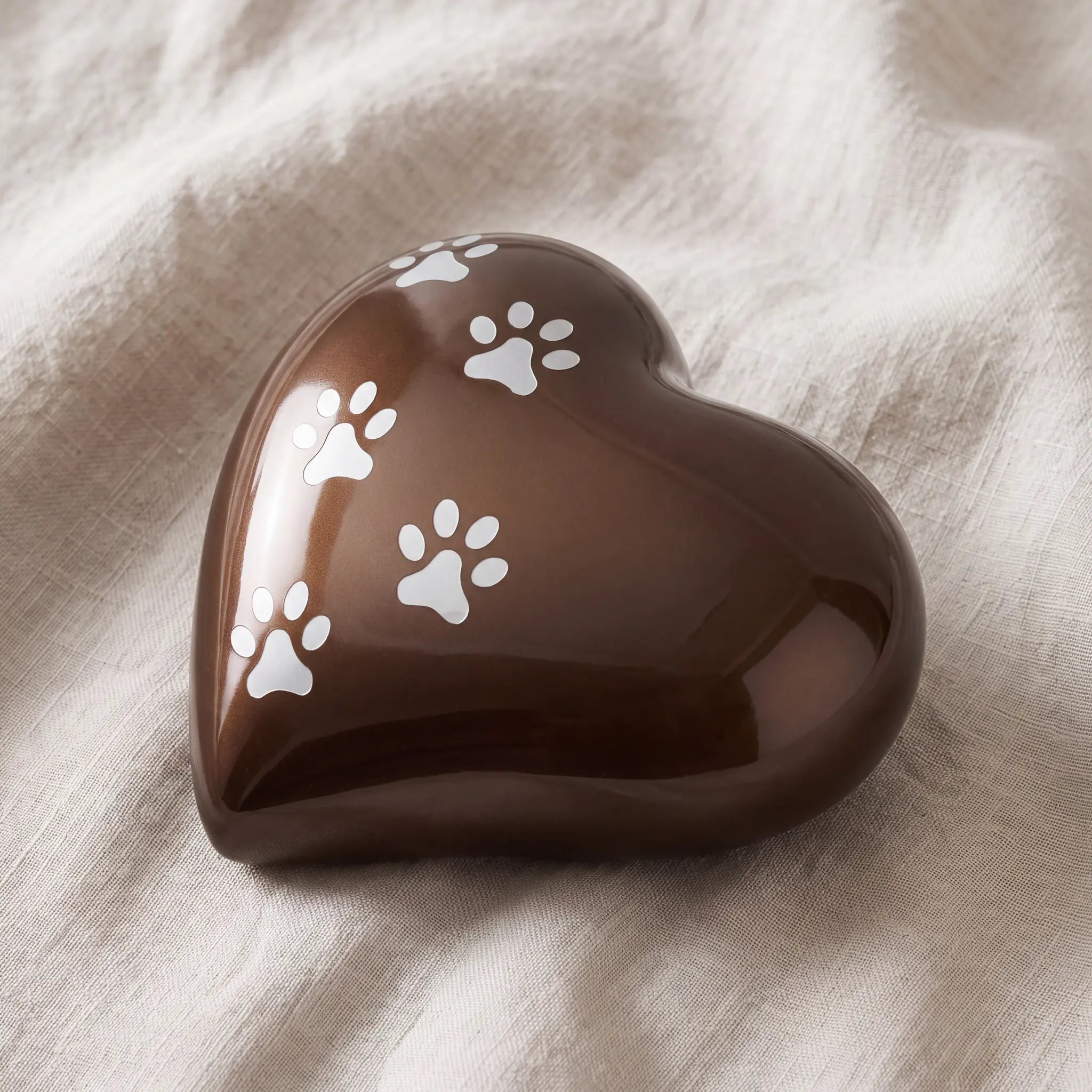 Heart-Pawprints-Pet-Urn-for-Ashes-in-Bronze-Silver-Large-On-Linen