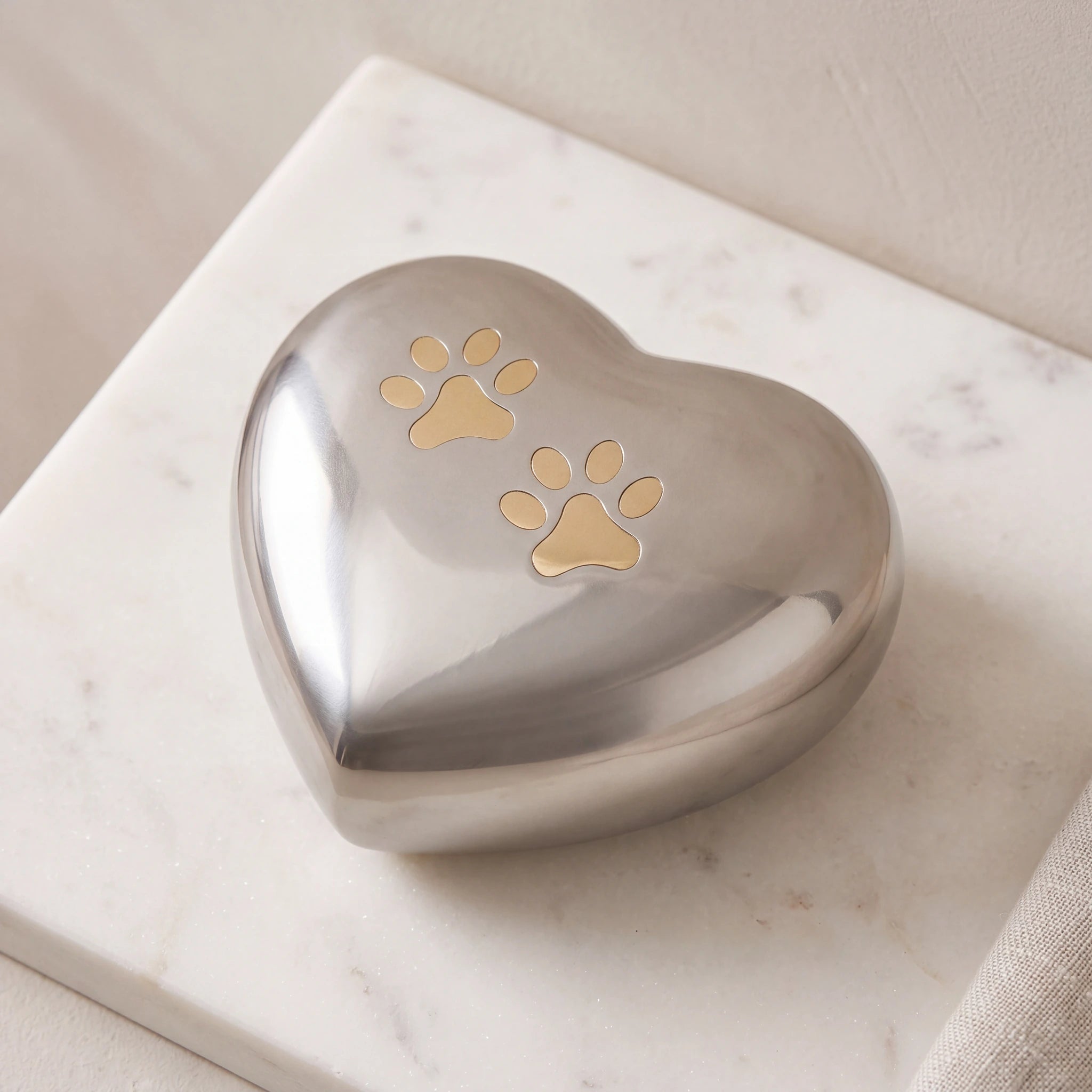 Heart-Pawprints-Pet-Urn-for-Ashes-in-Gold-Silver-On-Marble