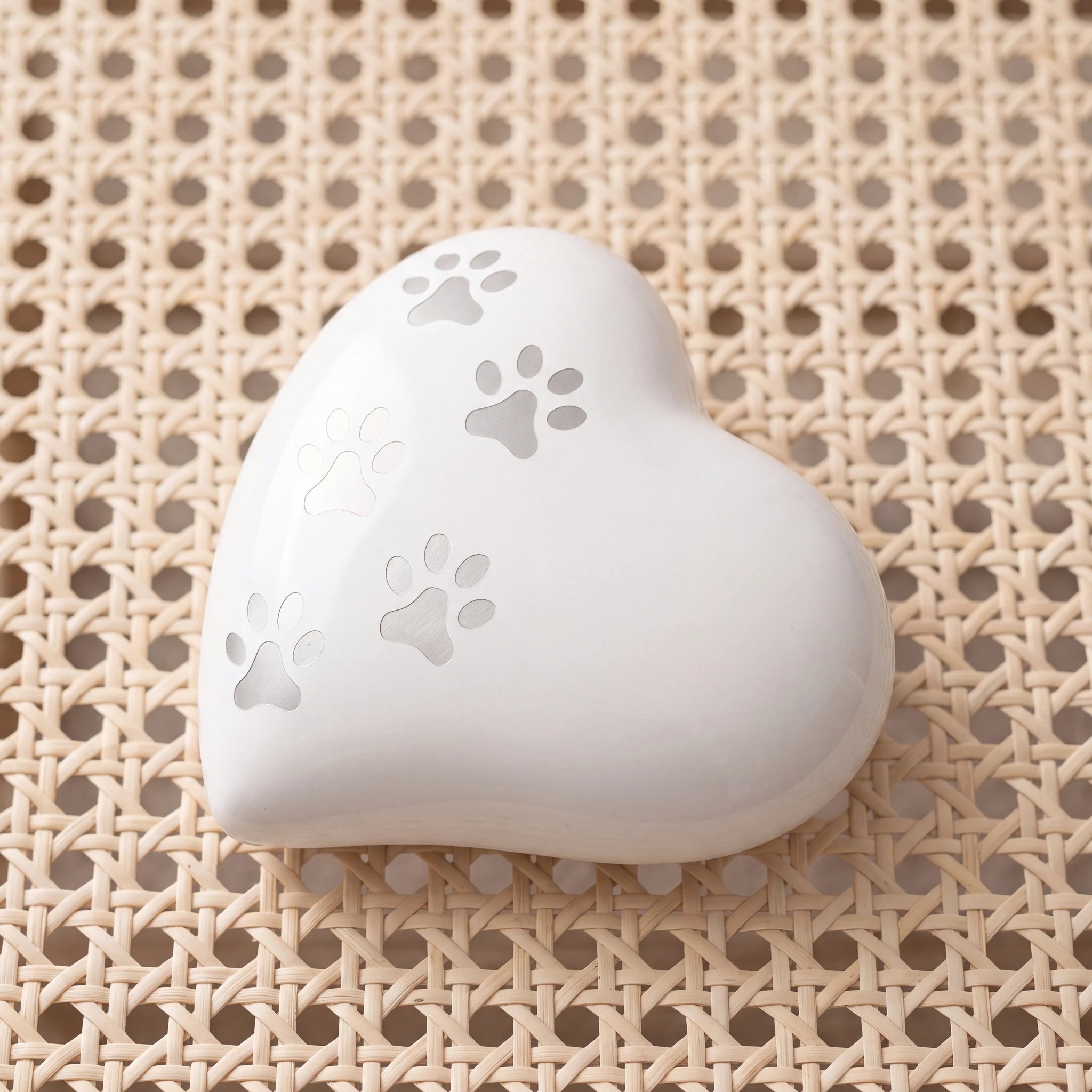 Heart-Pawprints-Pet-Urn-for-Ashes-in-White-Silver-Medium-heart_cane_above