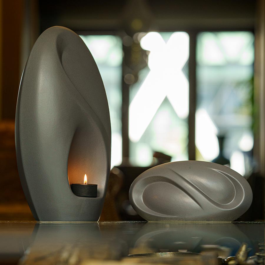 Infinity Cremation Urn for Ashes Matte Grey with Keepsake Side View on Table