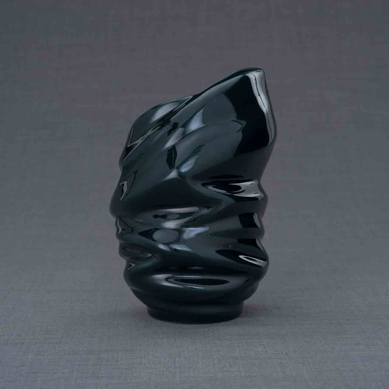 Light Ashes Keepsake Urn in Green Behind Grey Background