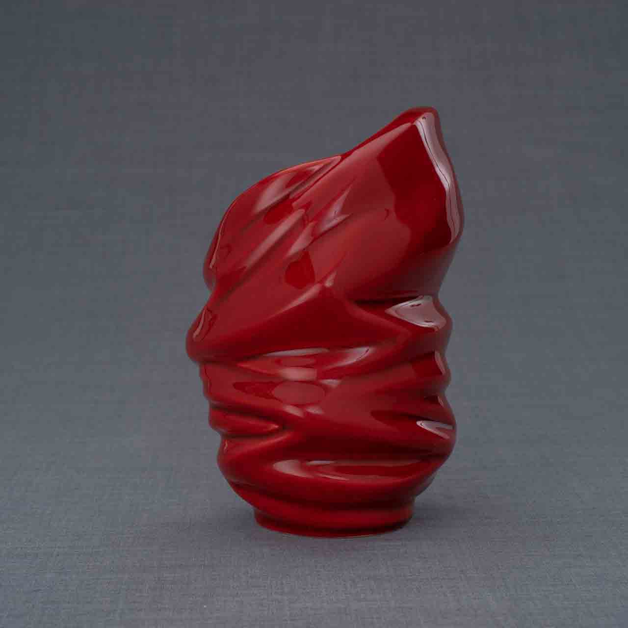 Light Ashes Keepsake Urn in Red Behind Grey Background