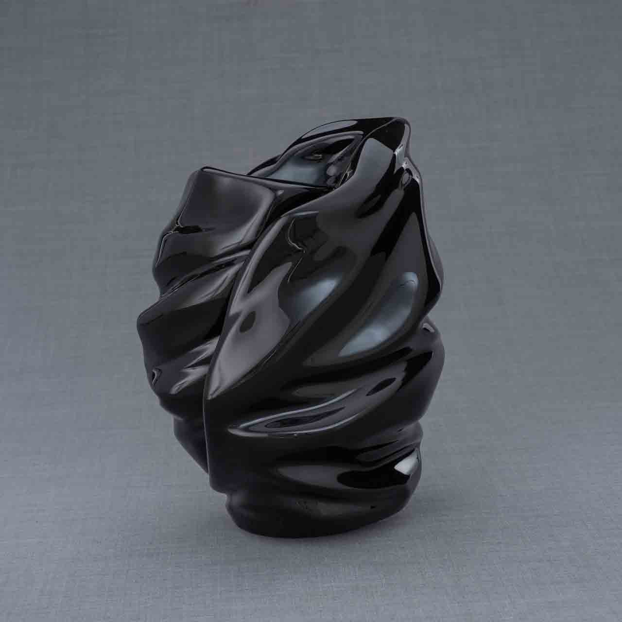 Light Cremation Urn for Ashes in Black Behind Grey Background