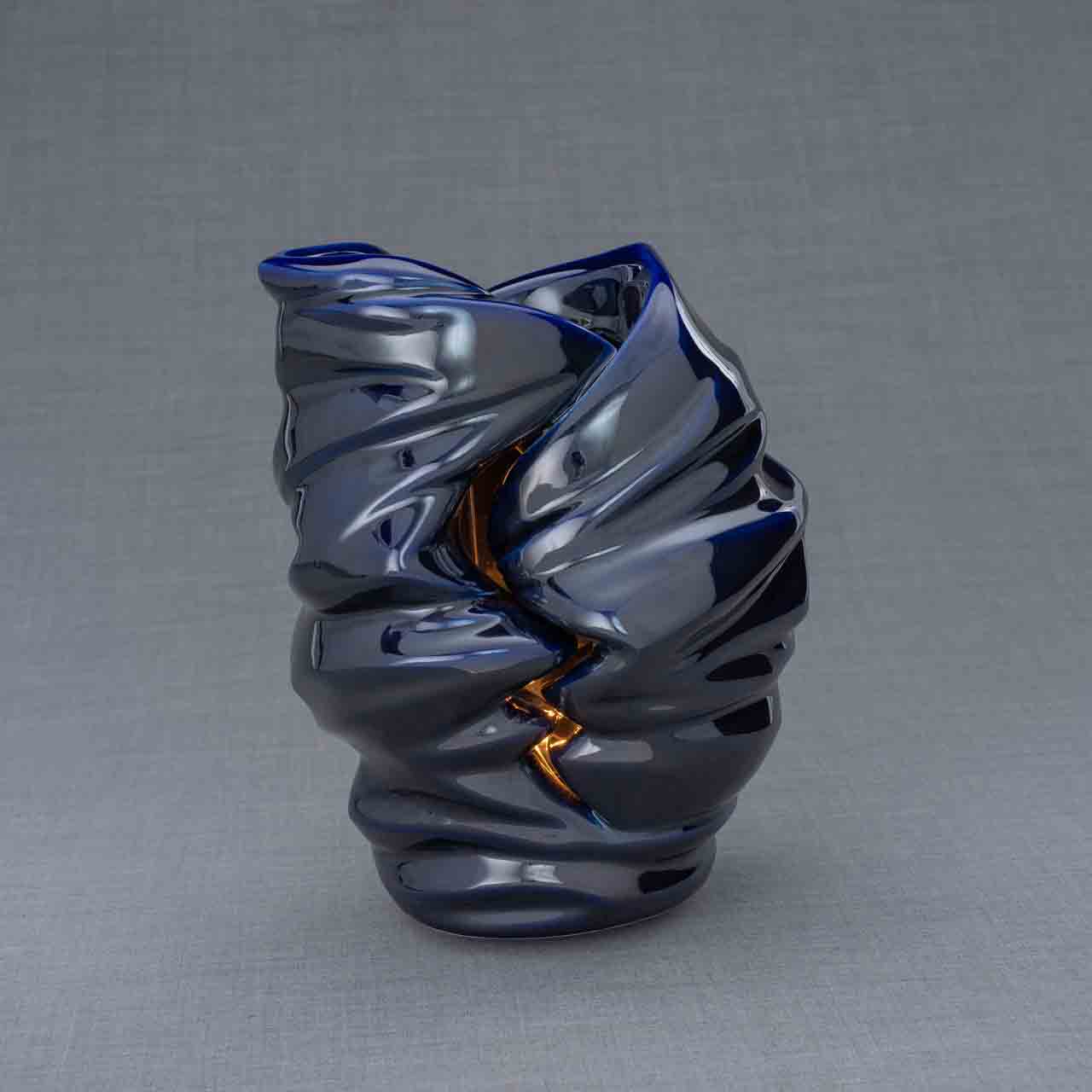 Light Cremation Urn for Ashes in Metallic Blue Dark Background