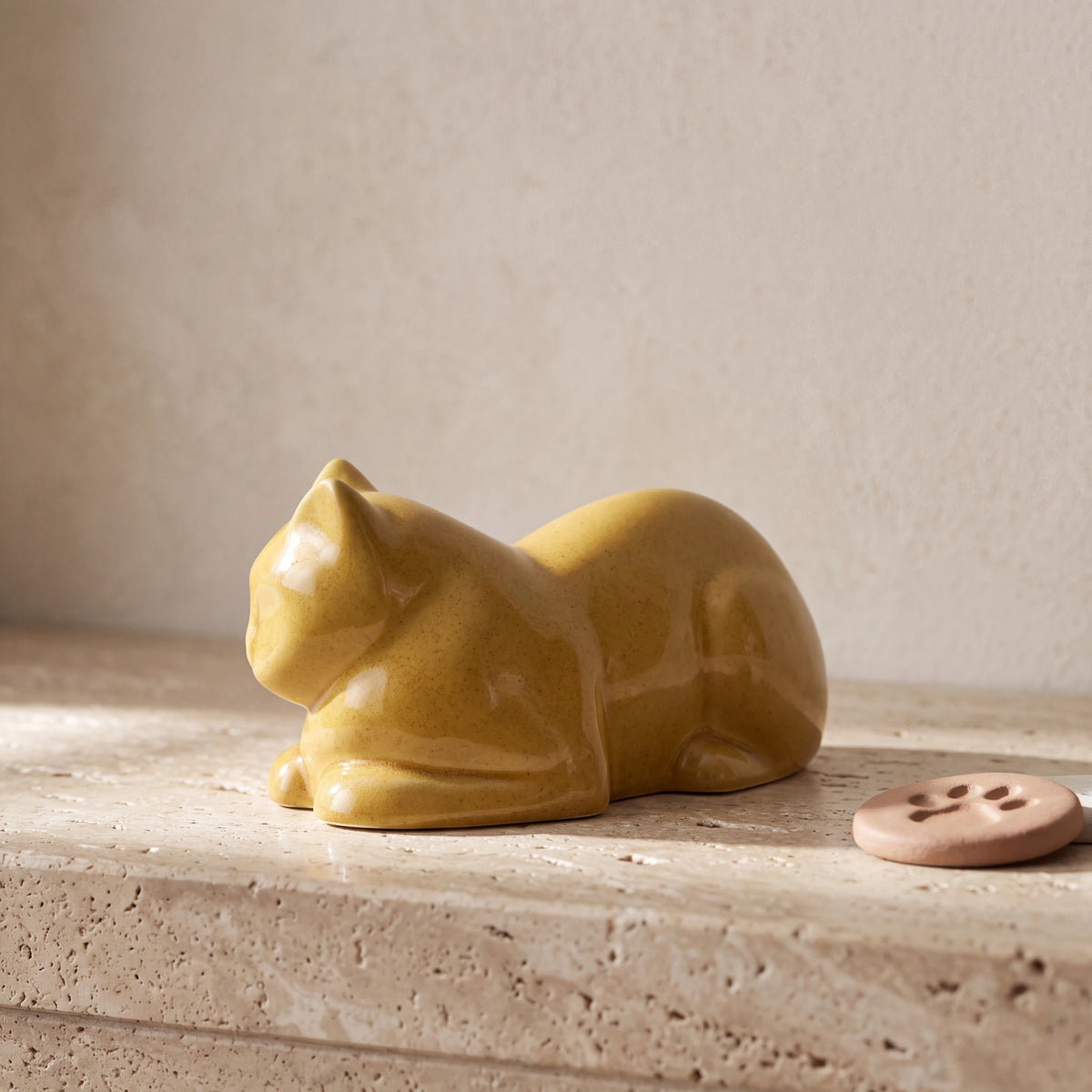 Lying-Cat-Mini-Urn-for-Ashes-in-Amber-Yellow-pet_paw_token