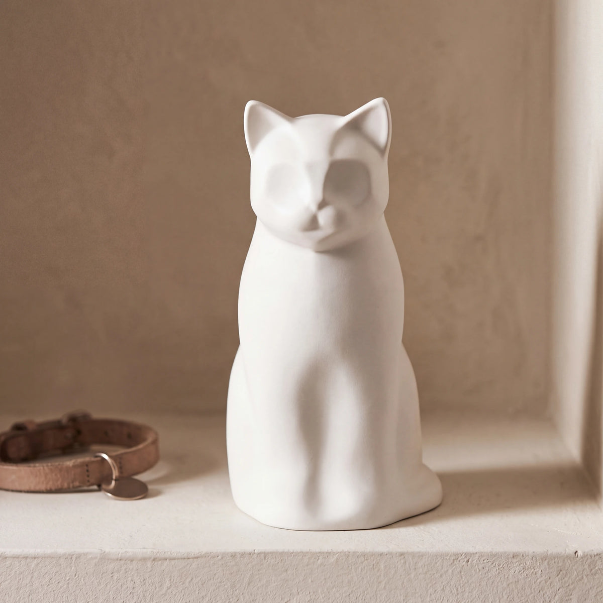 Meow-Cat-Urn-for-Ashes-in-Matte-White-pet_collar_ledge