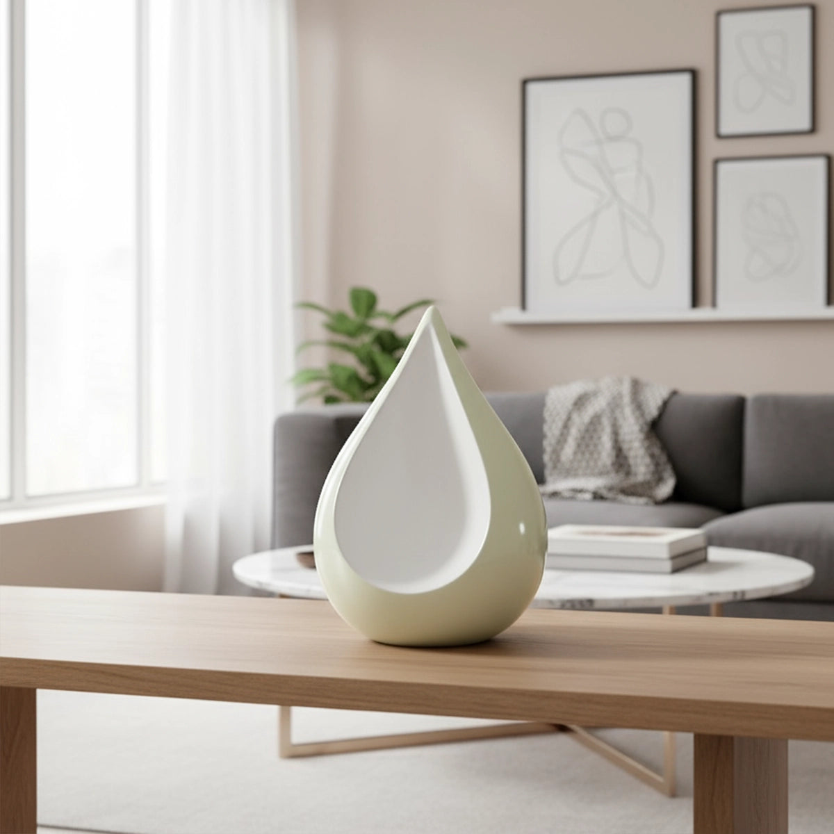 Odyssee Teardrop Urn for Ashes in Ivory and White on Coffee Table