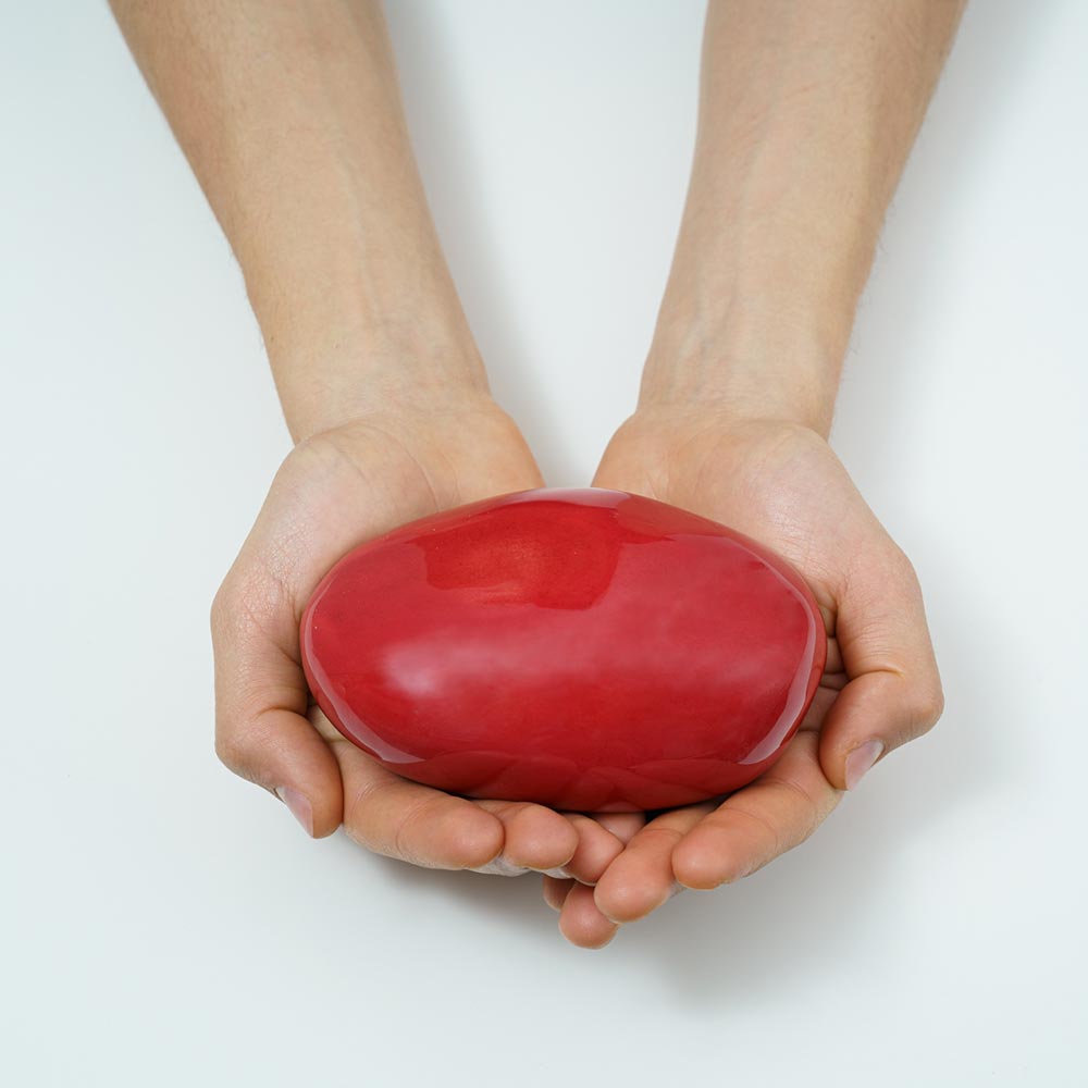 Palm Stone Ashes Keepsake Urn Red in Hands