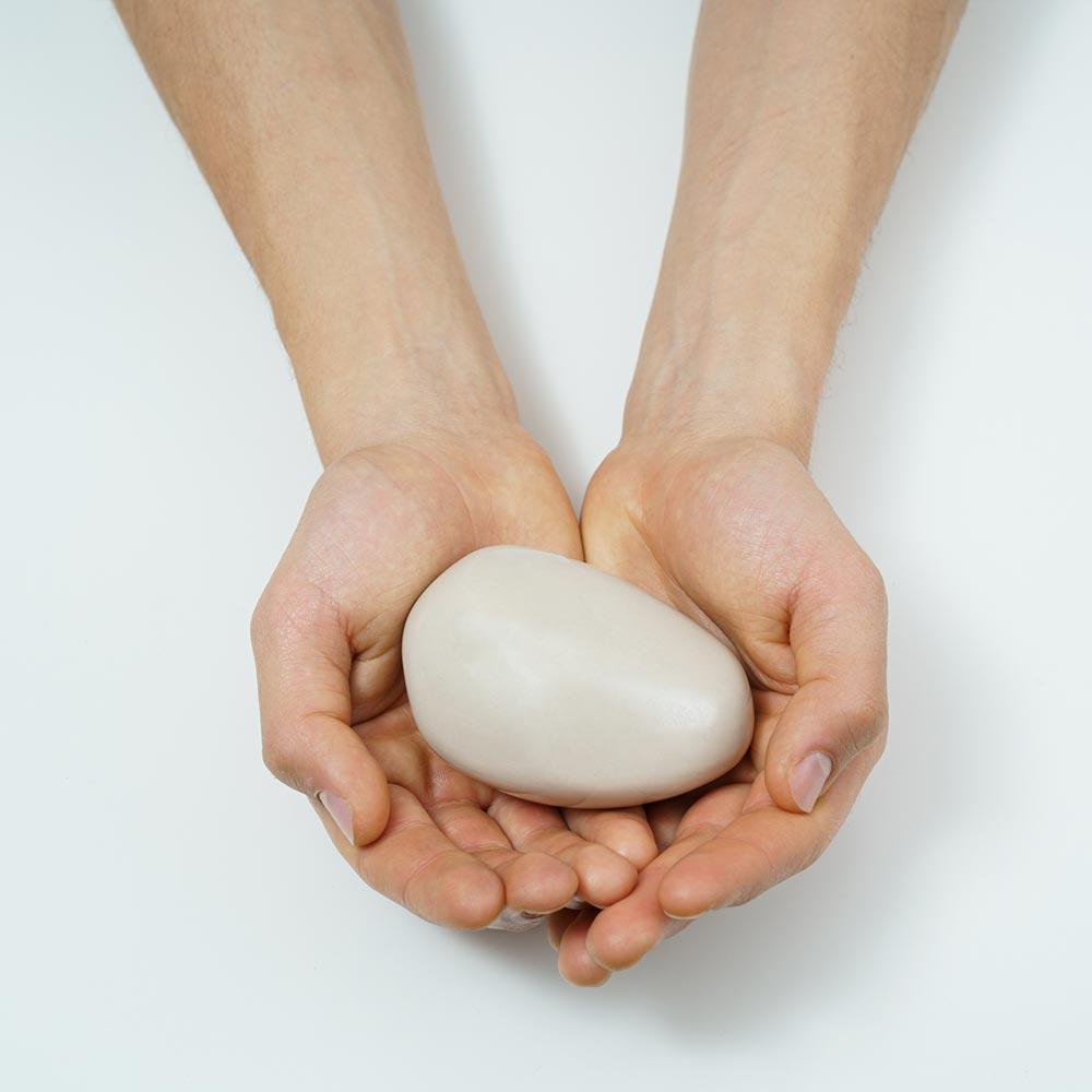 Palm Stone Ashes Keepsake Urn White in Hands
