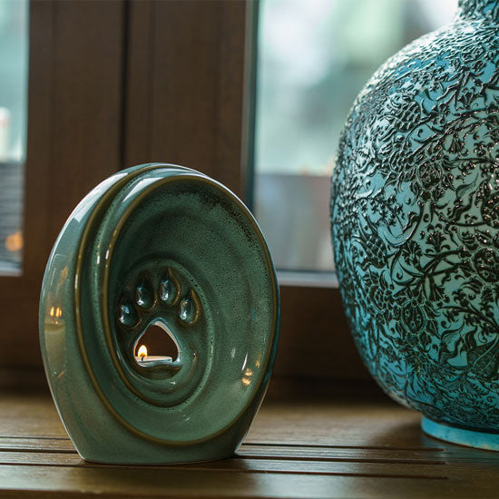 Paw Passage Cremation Urn For Ashes Oily Green By Window