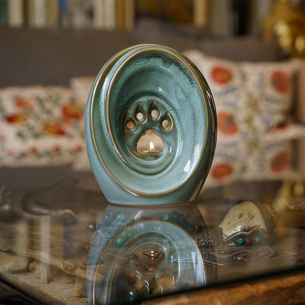Paw Passage Cremation Urn For Ashes Oily Green On Glass Table