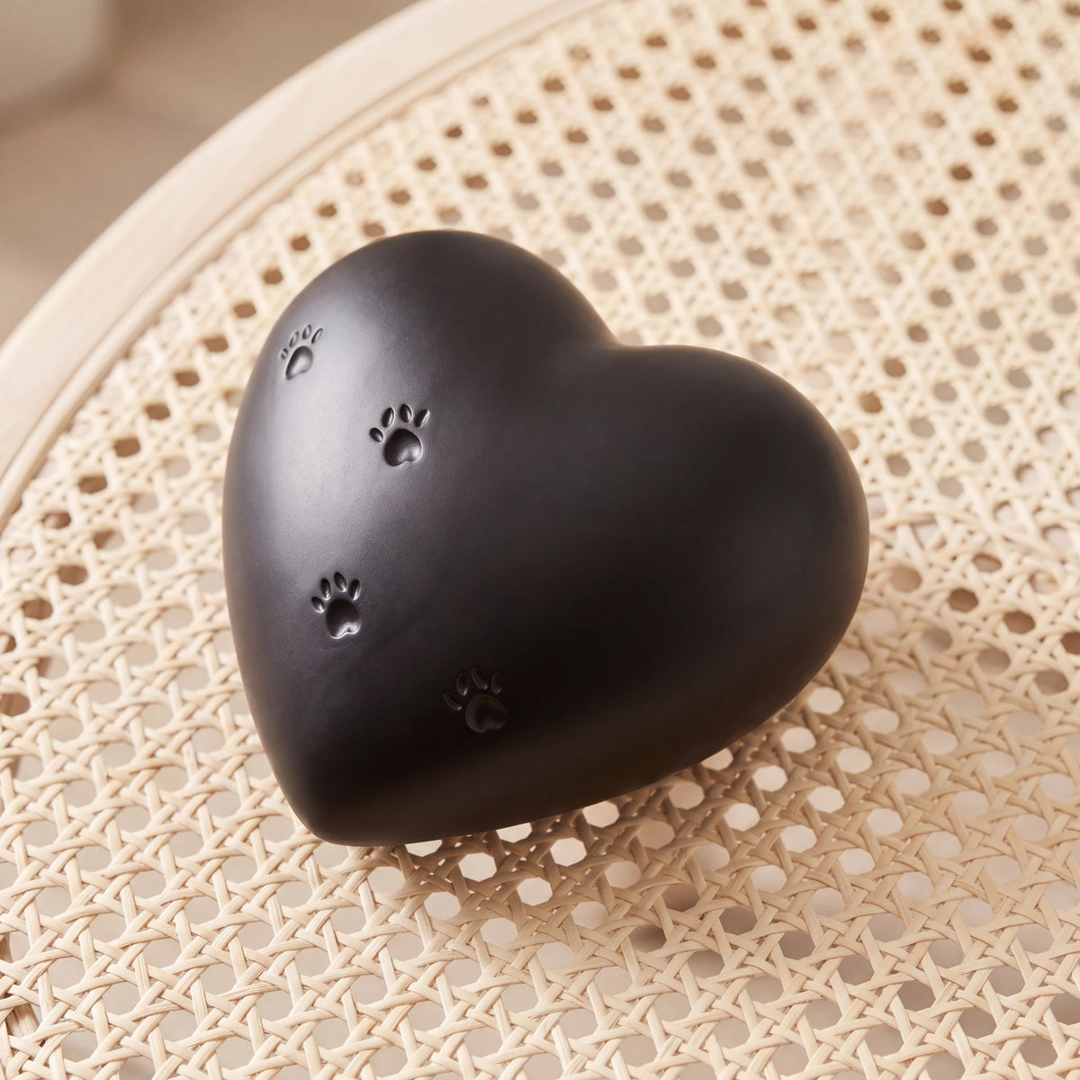 Paw-Print-Heart-Pet-Urn-for-Ashes-in-Black-heart_cane_above