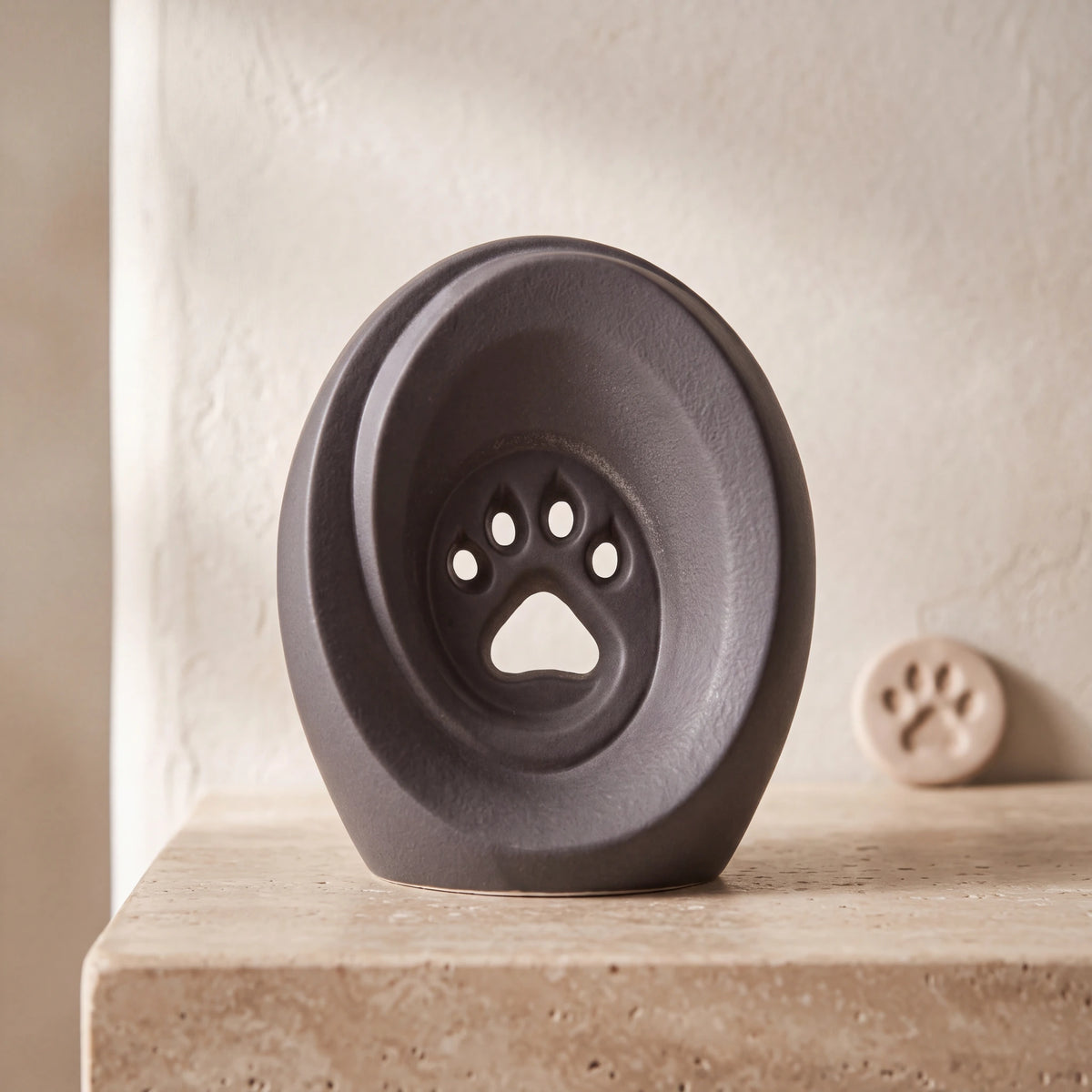 Paw-Print-Pet-Urn-for-Ashes-in-Charcoal-Grey-pet_paw_token