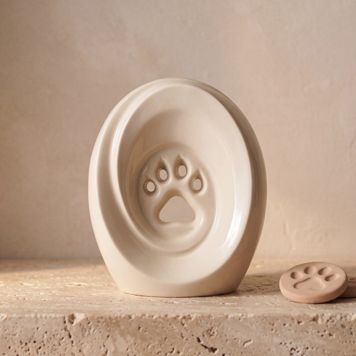 Paw-Print-Pet-Urn-for-Ashes-in-Cream-pet_paw_token