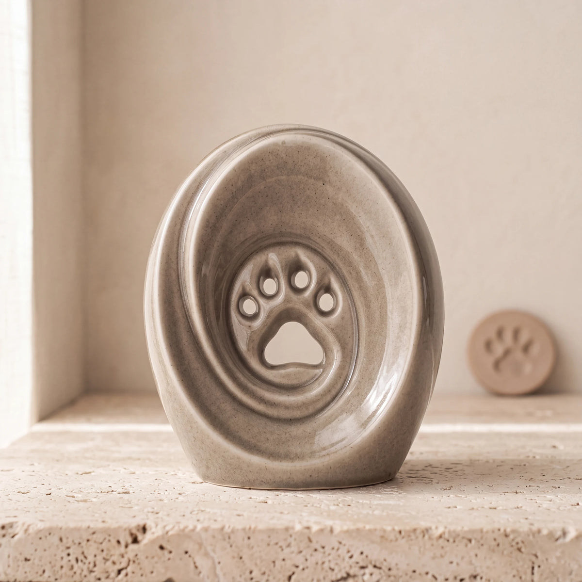 Paw-Print-Pet-Urn-for-Ashes-in-Dark-Sand-pet_paw_token