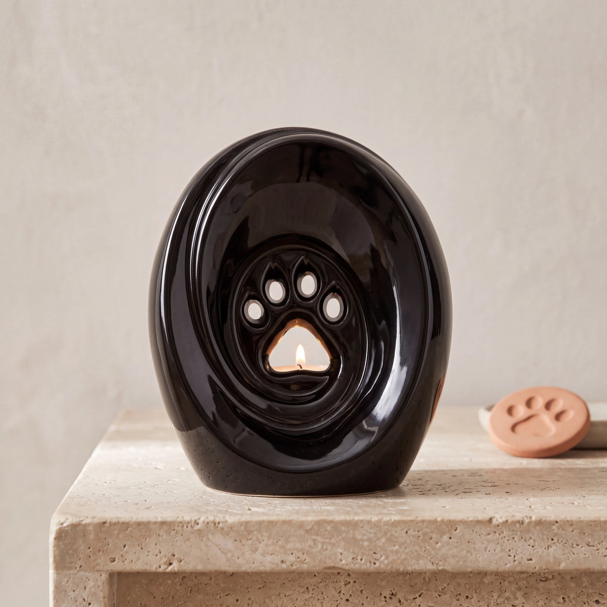 Paw-Print-Pet-Urn-for-Ashes-in-Glossy-Black-pet_paw_token