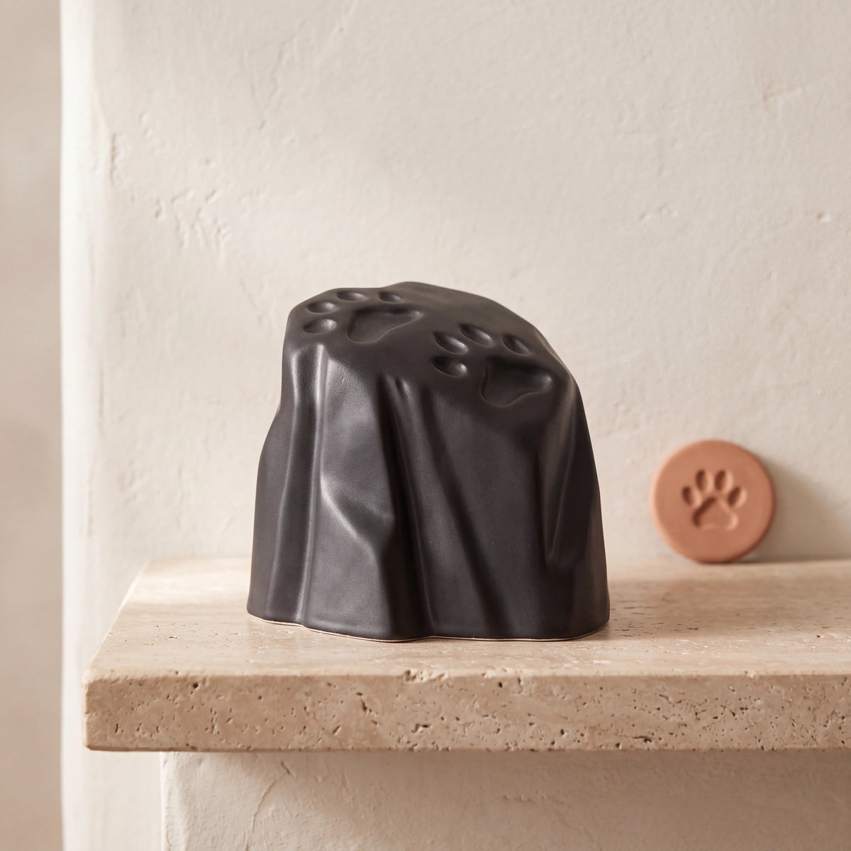 Paw-Prints-Pet-Urn-for-Ashes-in-Matte-Black-pet_paw_token
