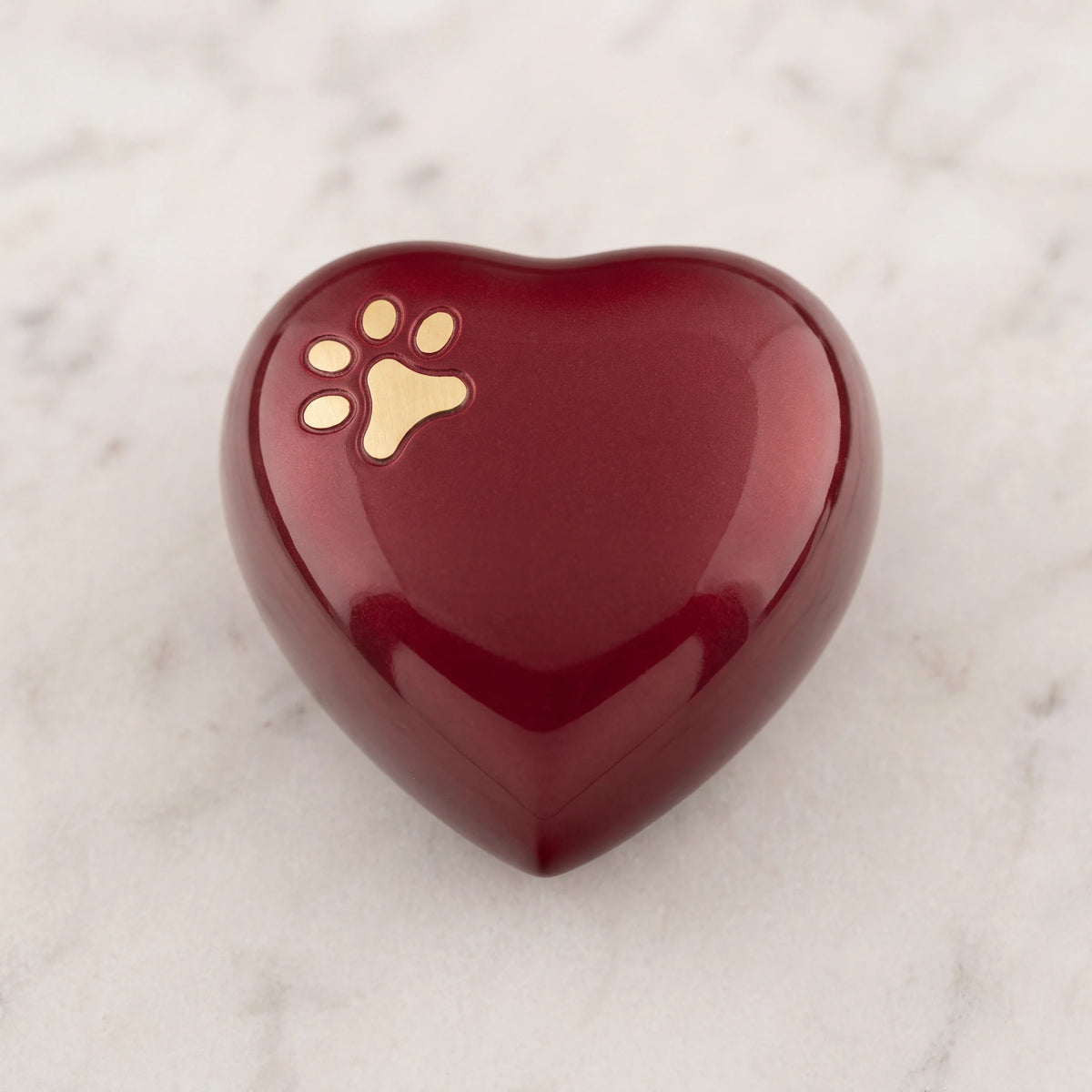Pawprint-Heart-Pet-Keepsake-Urn-for-Ashes-in-Burgundy-Silver-On-Marble