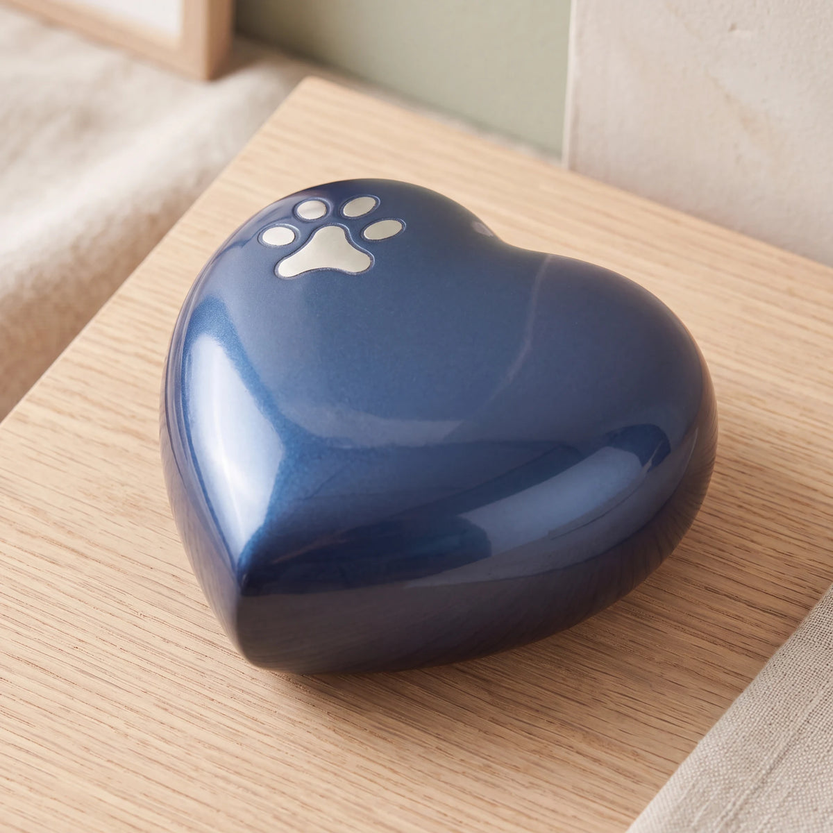Pawprint-Heart-Pet-Keepsake-Urn-for-Ashes-in-Midnight-Blue-Silver-On-Oak