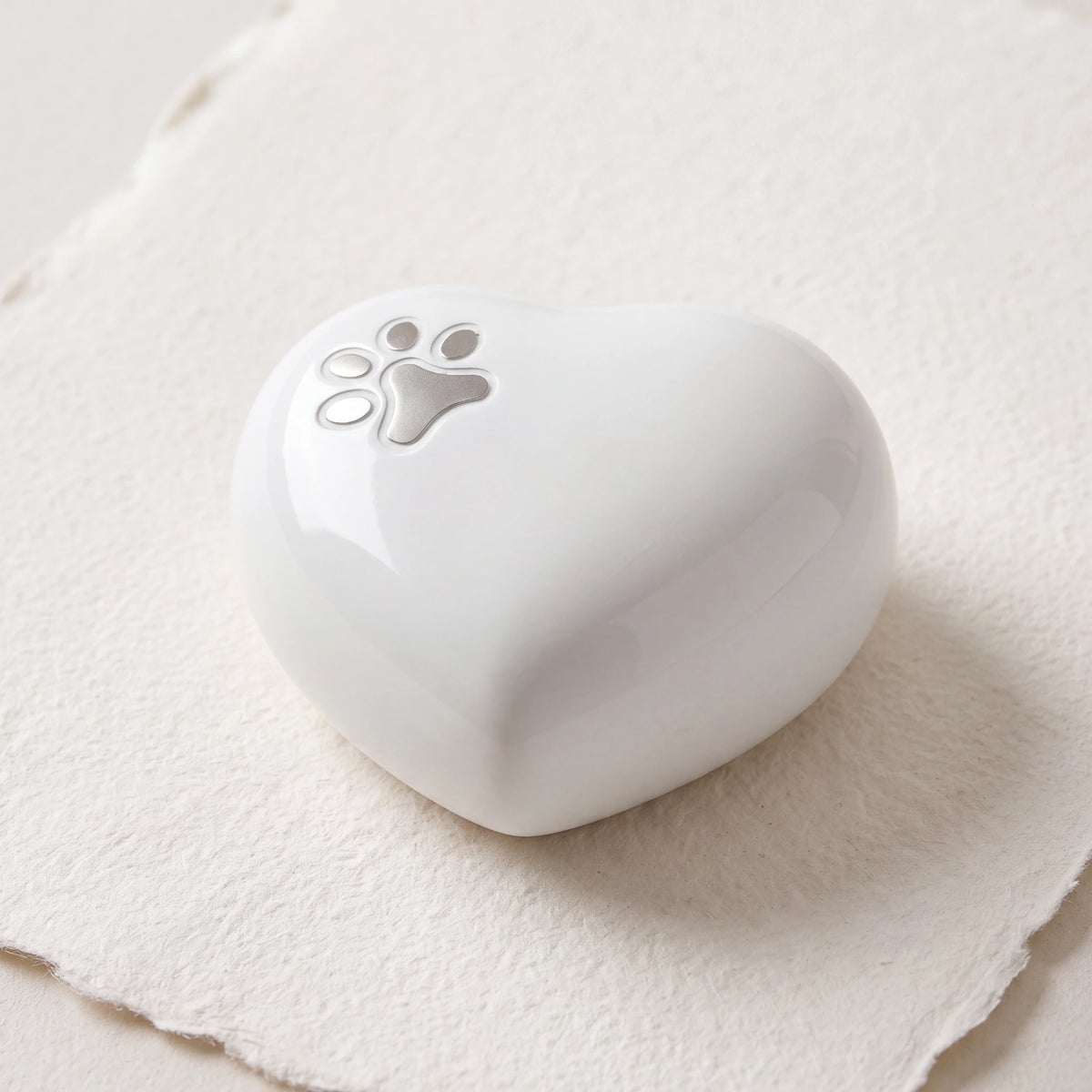 Pawprint-Heart-Pet-Keepsake-Urn-for-Ashes-in-White-Silver-heart_paper_above