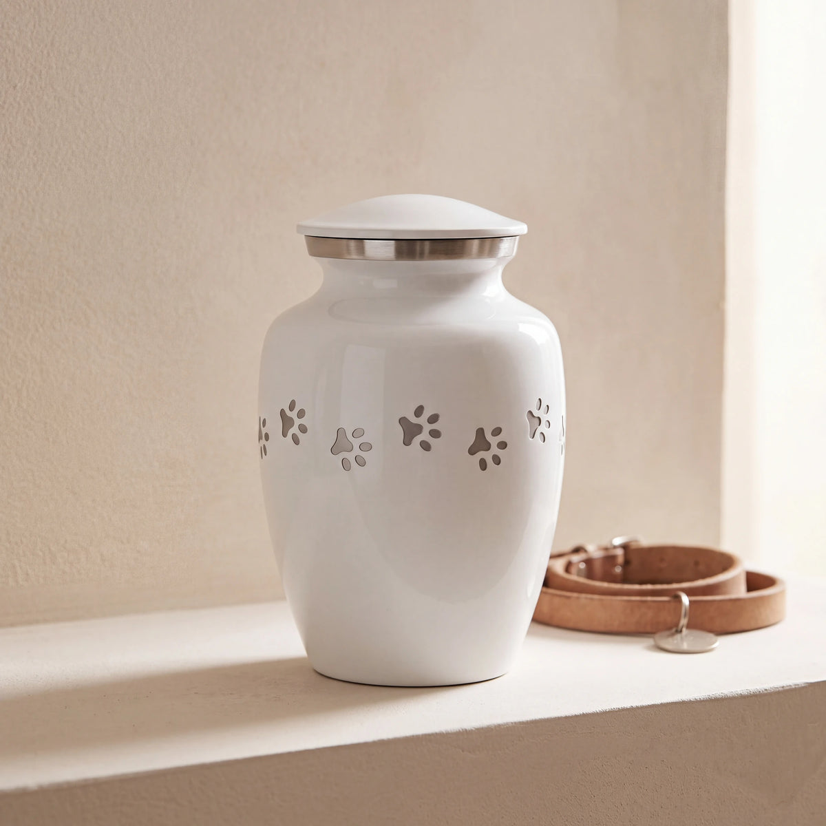 Pawprint-Pet-Urn-for-Ashes-in-White-Silver-Medium-pet_collar_ledge